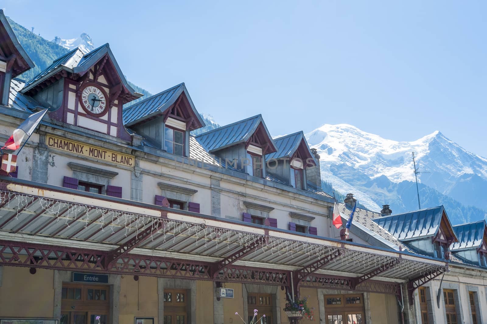 CHAMONIX, FRANCE - SEPTEMBER 02: Facade of Chamonix train station, with Mont Blanc in the background. The city is one of the stages in the popular Mont Blanc tour. September 02, 2014 in Chamonix.