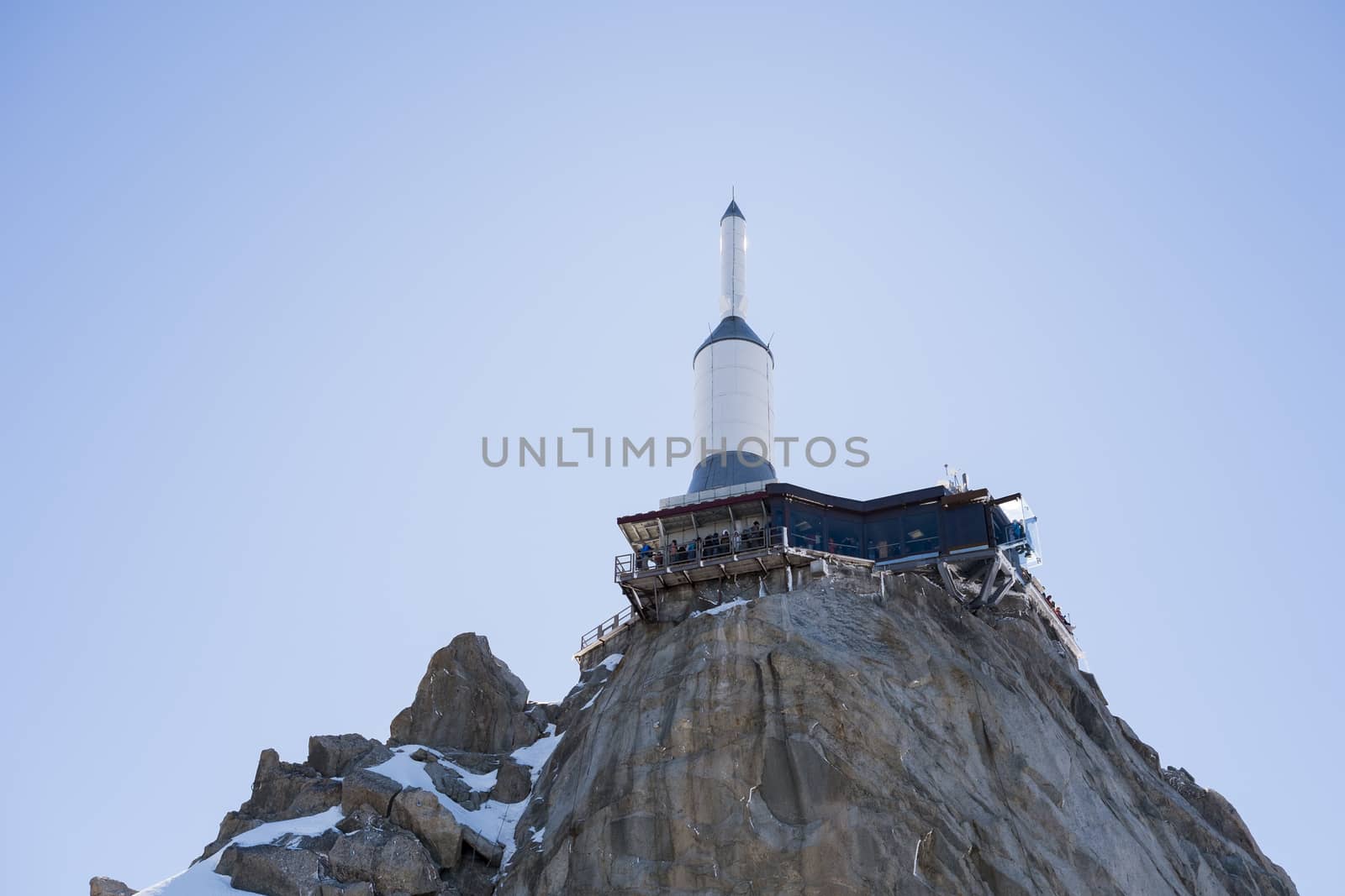 CHAMONIX, FRANCE - SEPTEMBER 02: Low angle shot of Aiguille du Midi complex. At 3842 meters, the complex offers close views of the Mont Blanc summit. September 02, 2014 in Chamonix.