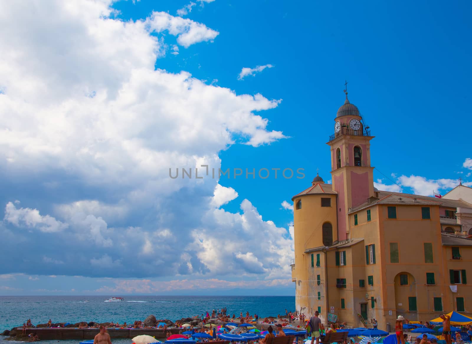 Seascape with big church on the right, blue cloudy sky