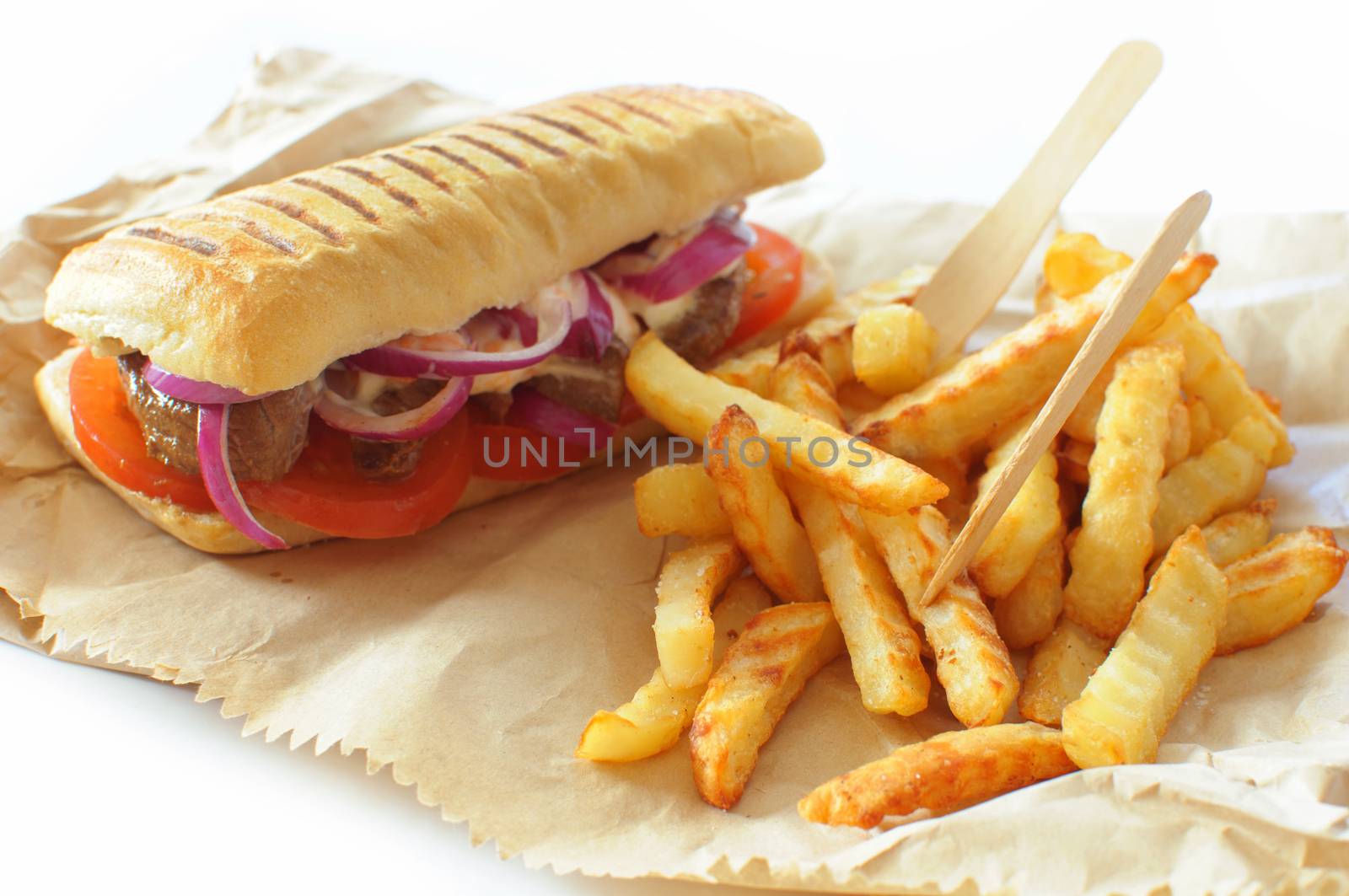 Beef sandwich with a portion of french fries takeaway