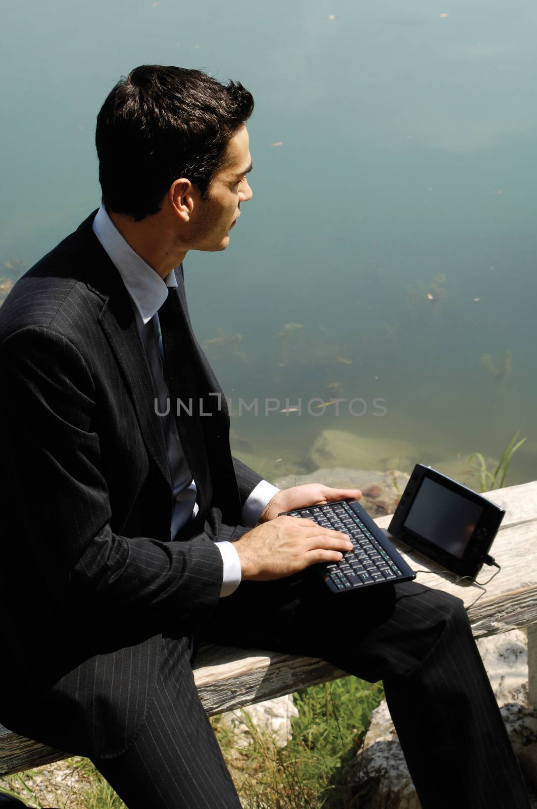 man with laptop on the nature by toocan