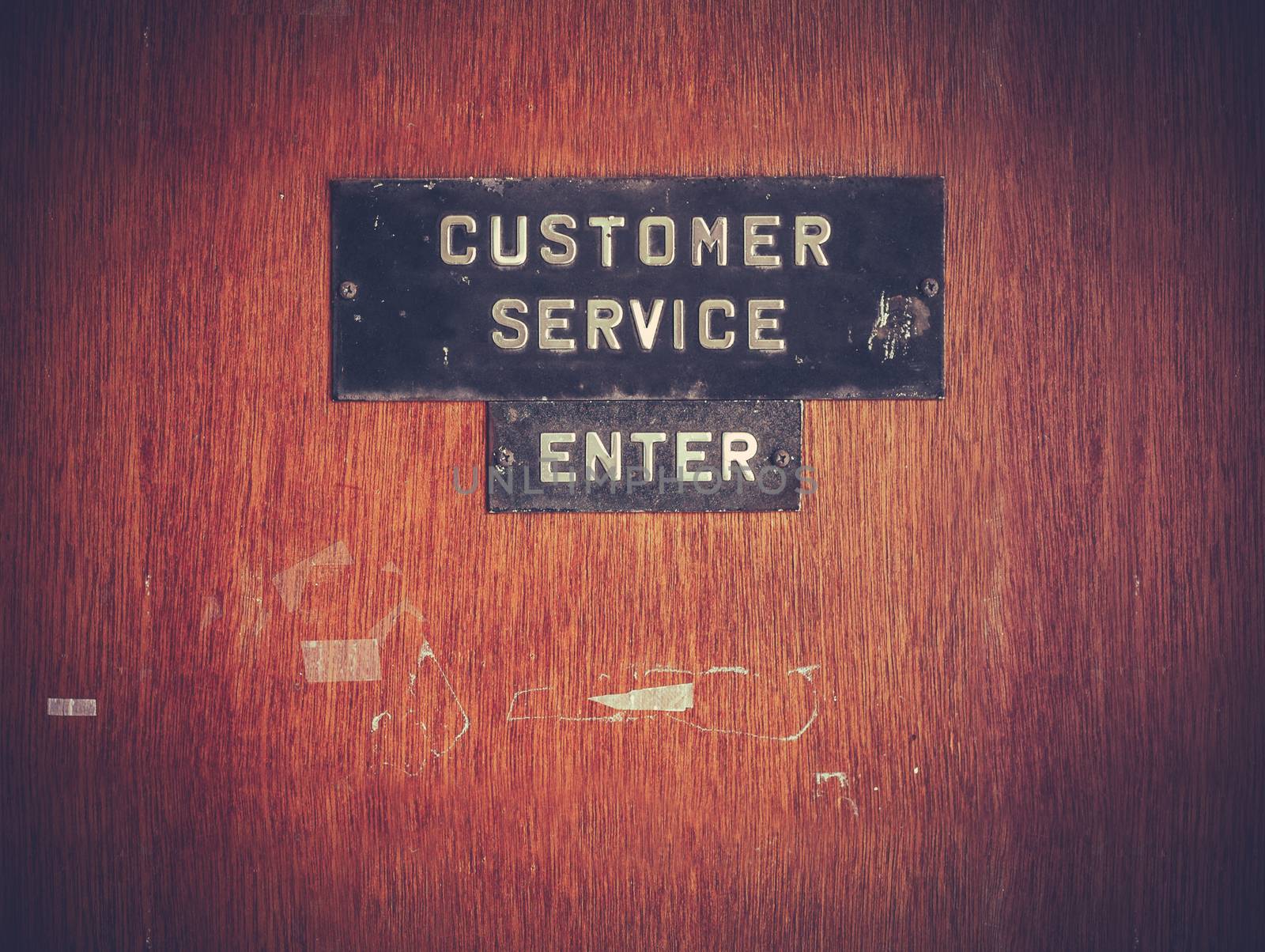 Grungy Customer Service Sign On Office Door