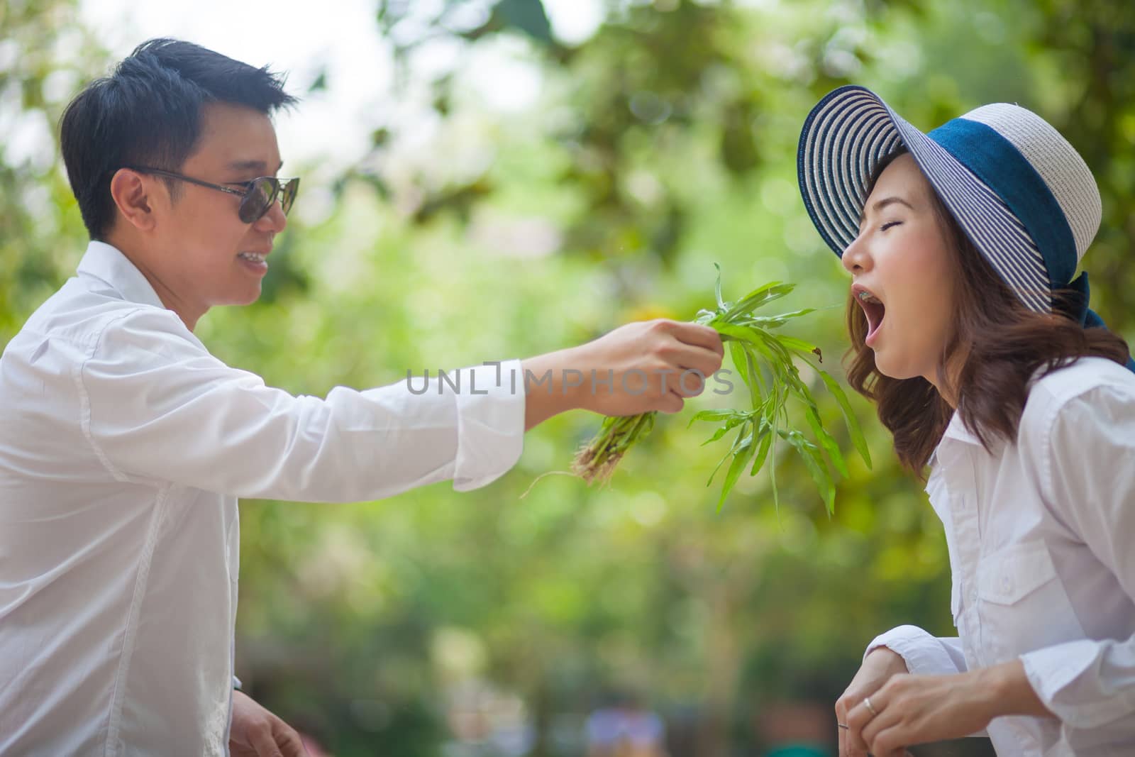 Happy young asian couple in love outdoor