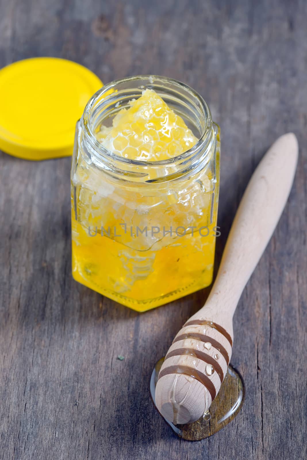 honeycomb and honey in glass jars