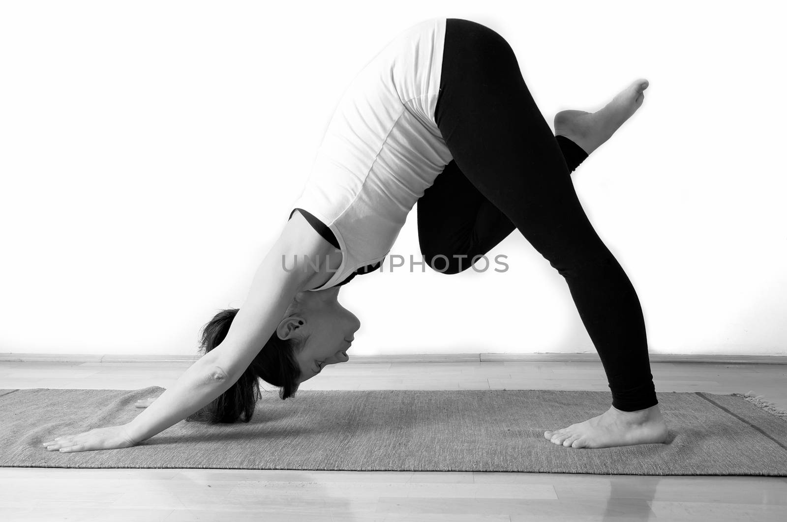 Young girl doing yoga pose by anderm