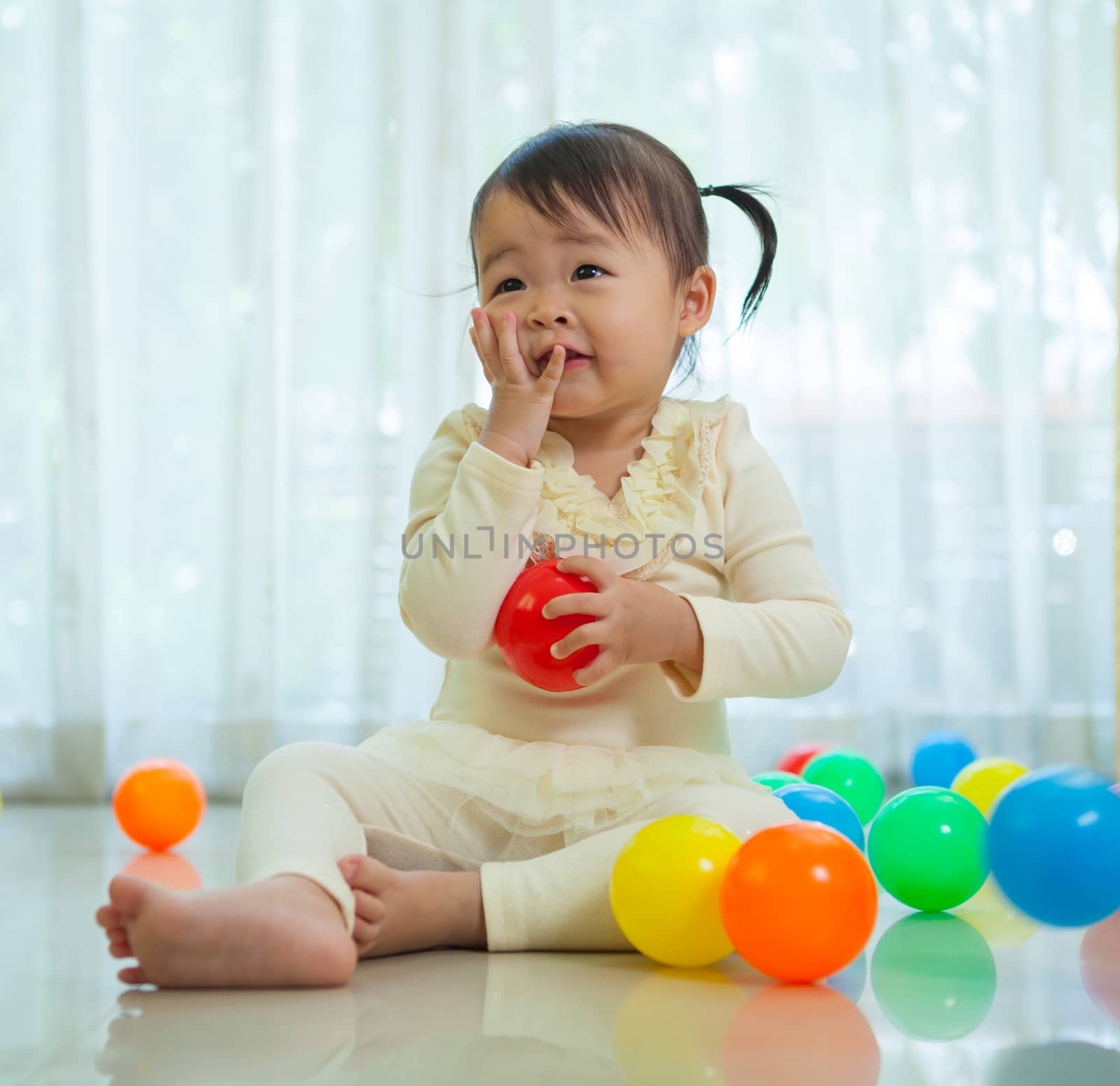 Portrait of little asian girl in home