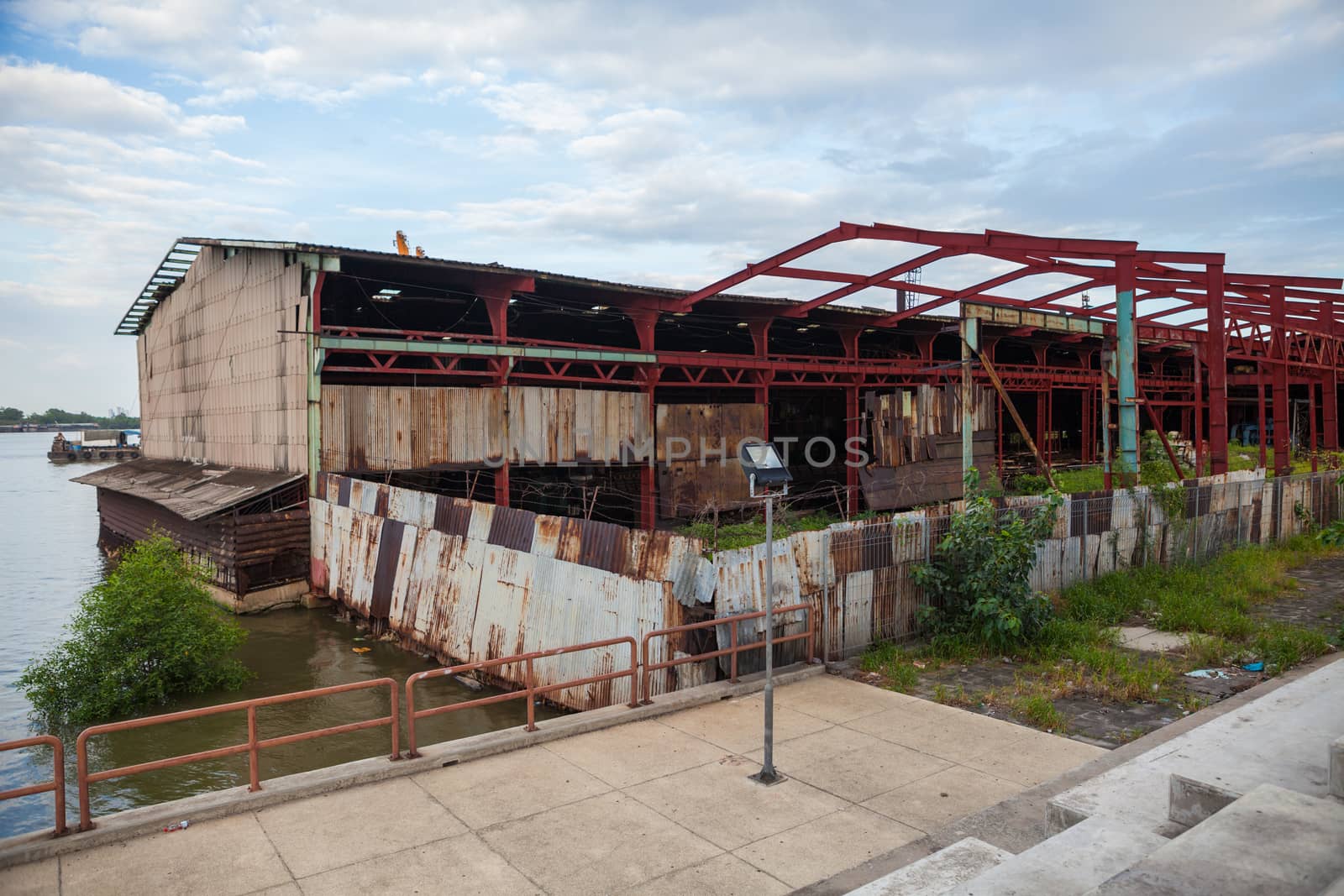 Old abandoned factory during demolition near river