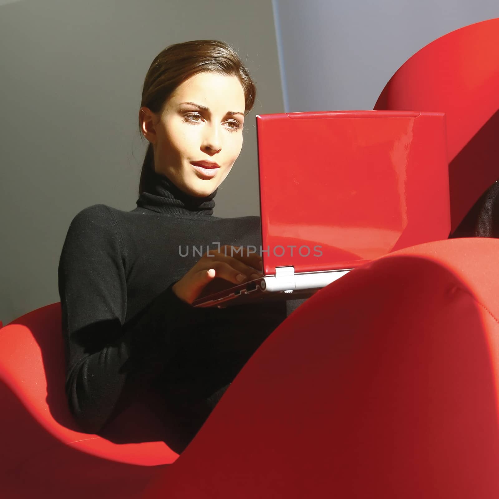 Portrait of an attractive young woman using laptop at home 