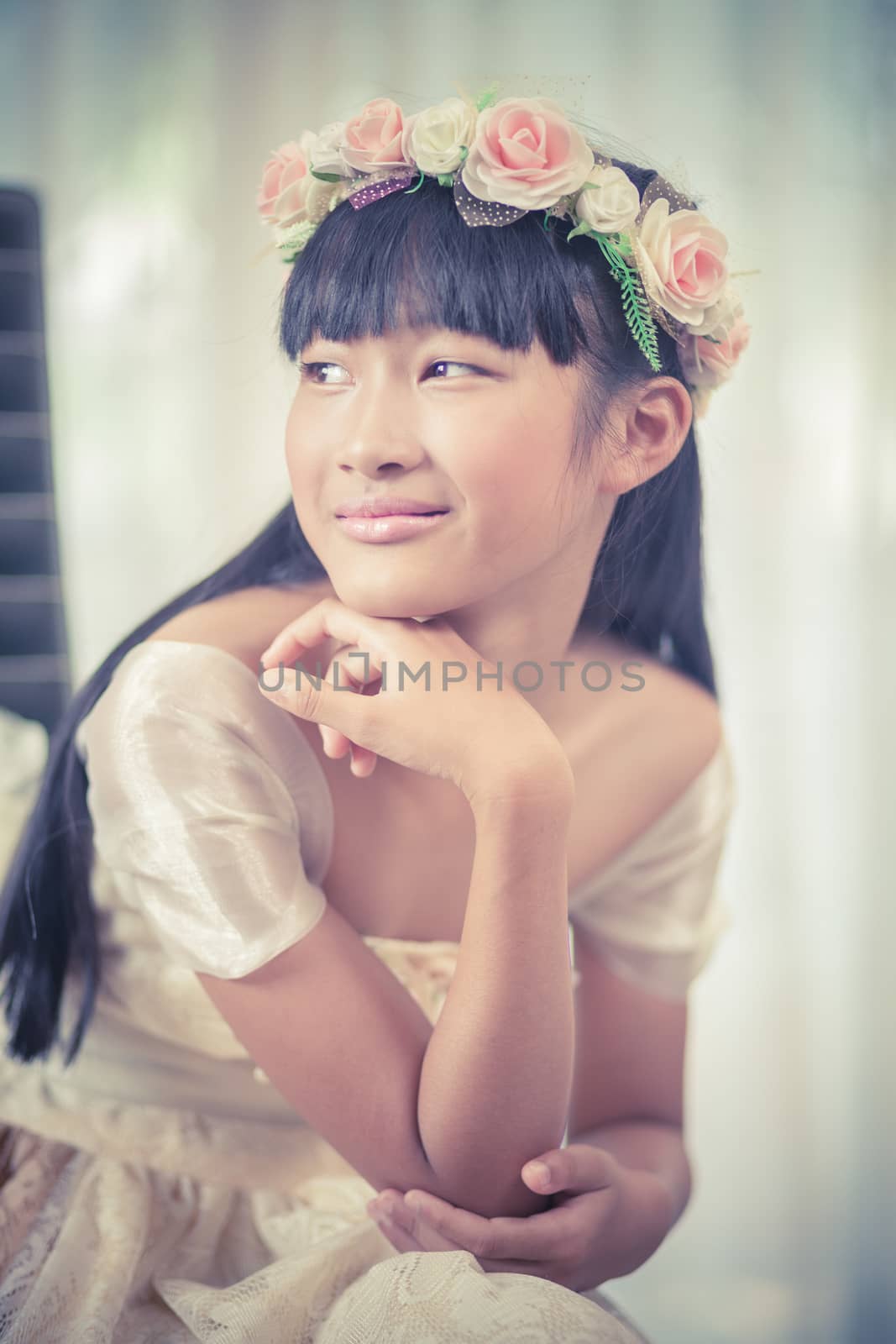 Portrait of a beautiful asian girl with flower crown