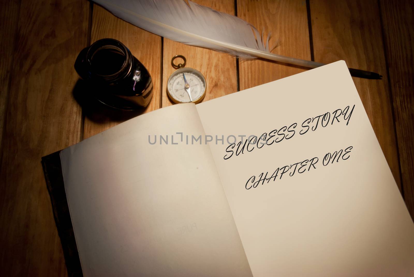 Success story handwritten first page of a book with quill and ink