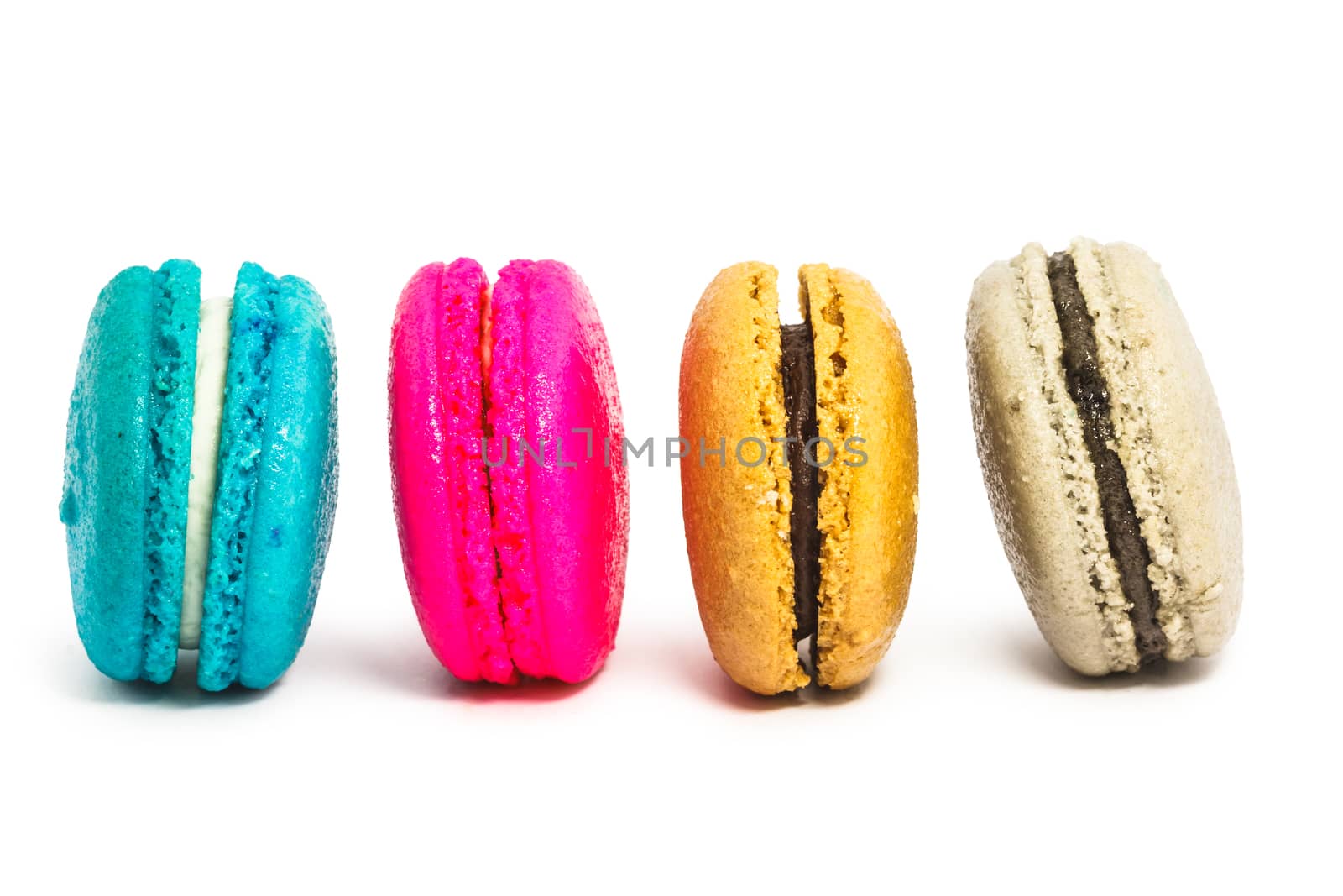 Colorful french macaroons on white background