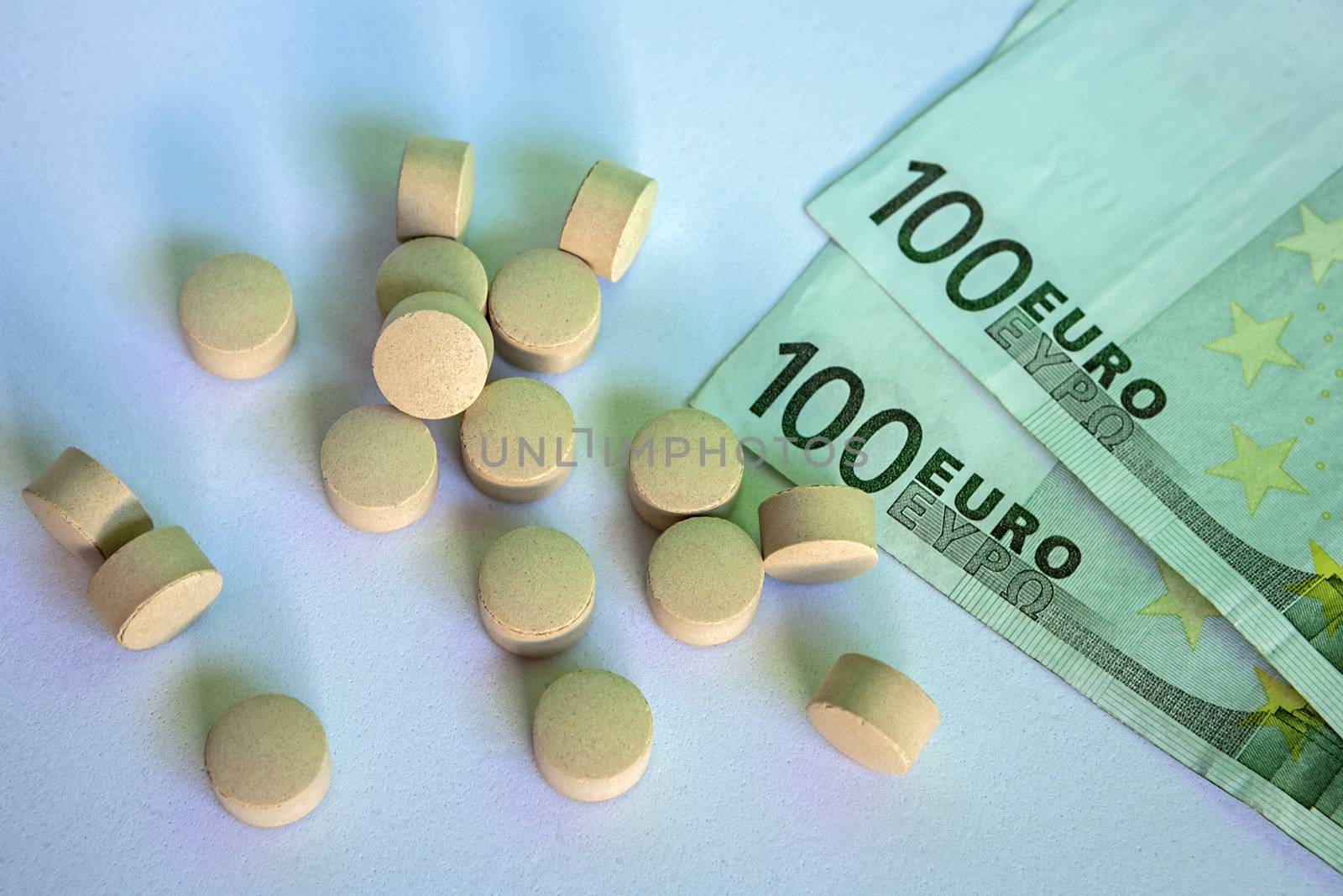 Pills and money, abstract business medical background, concept of pharmaceutical copayment