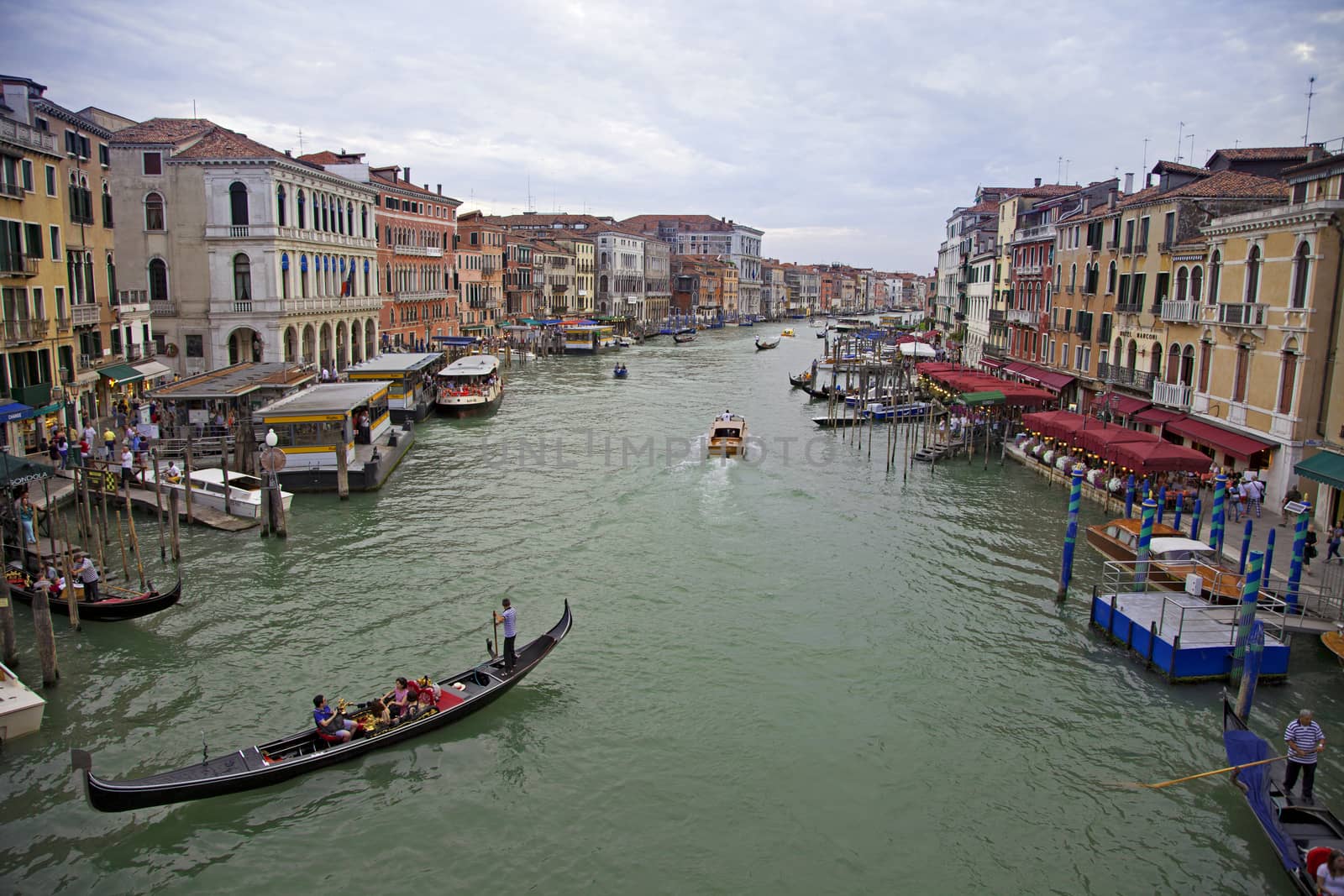 Tourists enjoying gondola rides in Venice, Italy  by haiderazim