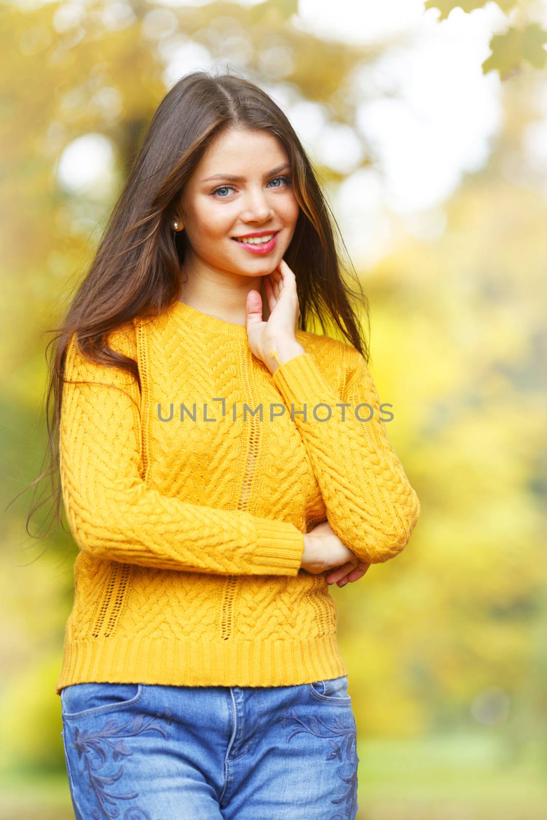 Young brunette in autumn park by Yellowj