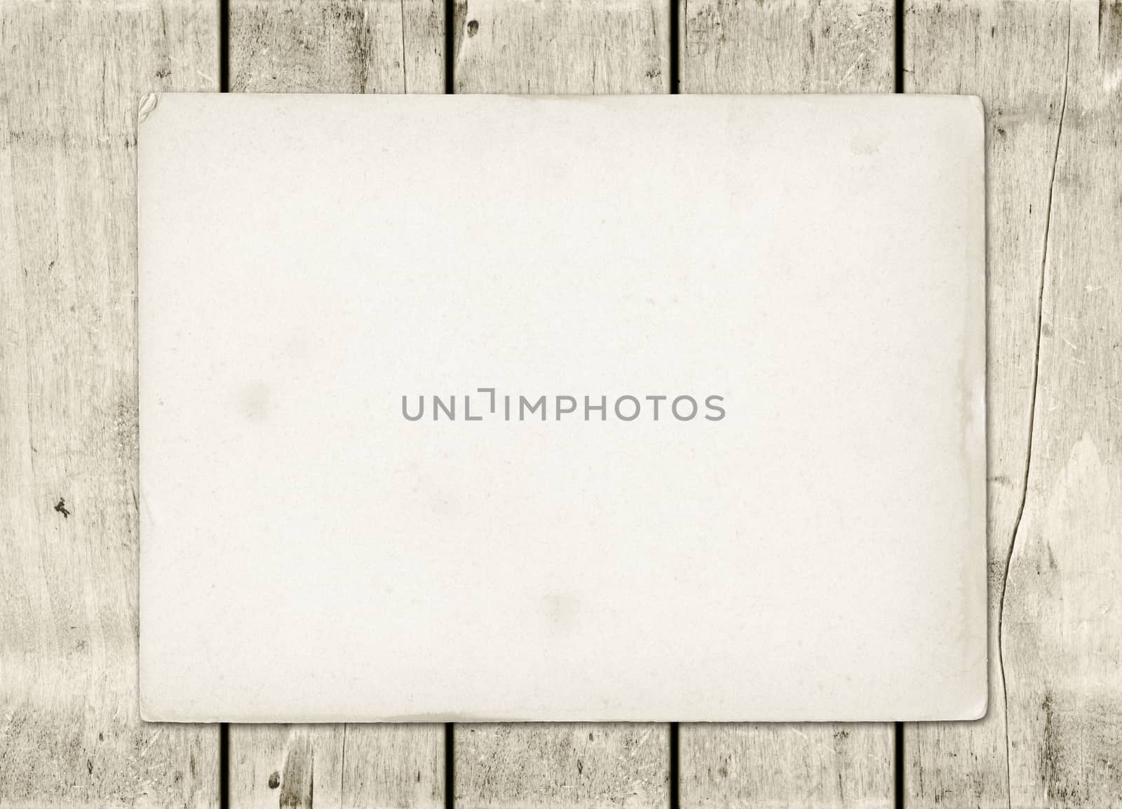 Blank vintage paper sheet on a white wood board panel