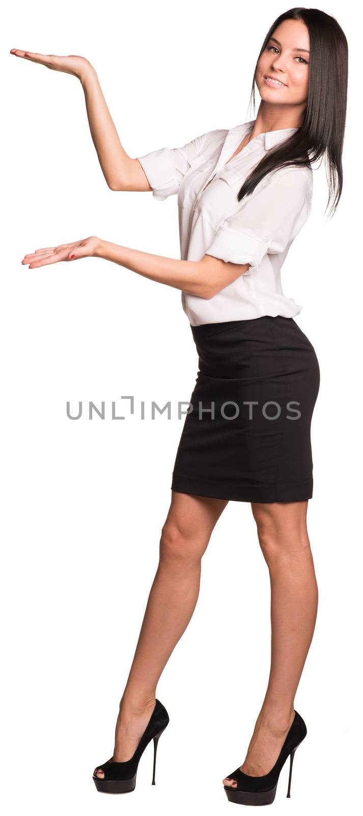 Beautiful businesswomen in blouse and skirt standing and showing empty palms. Isolated on white background