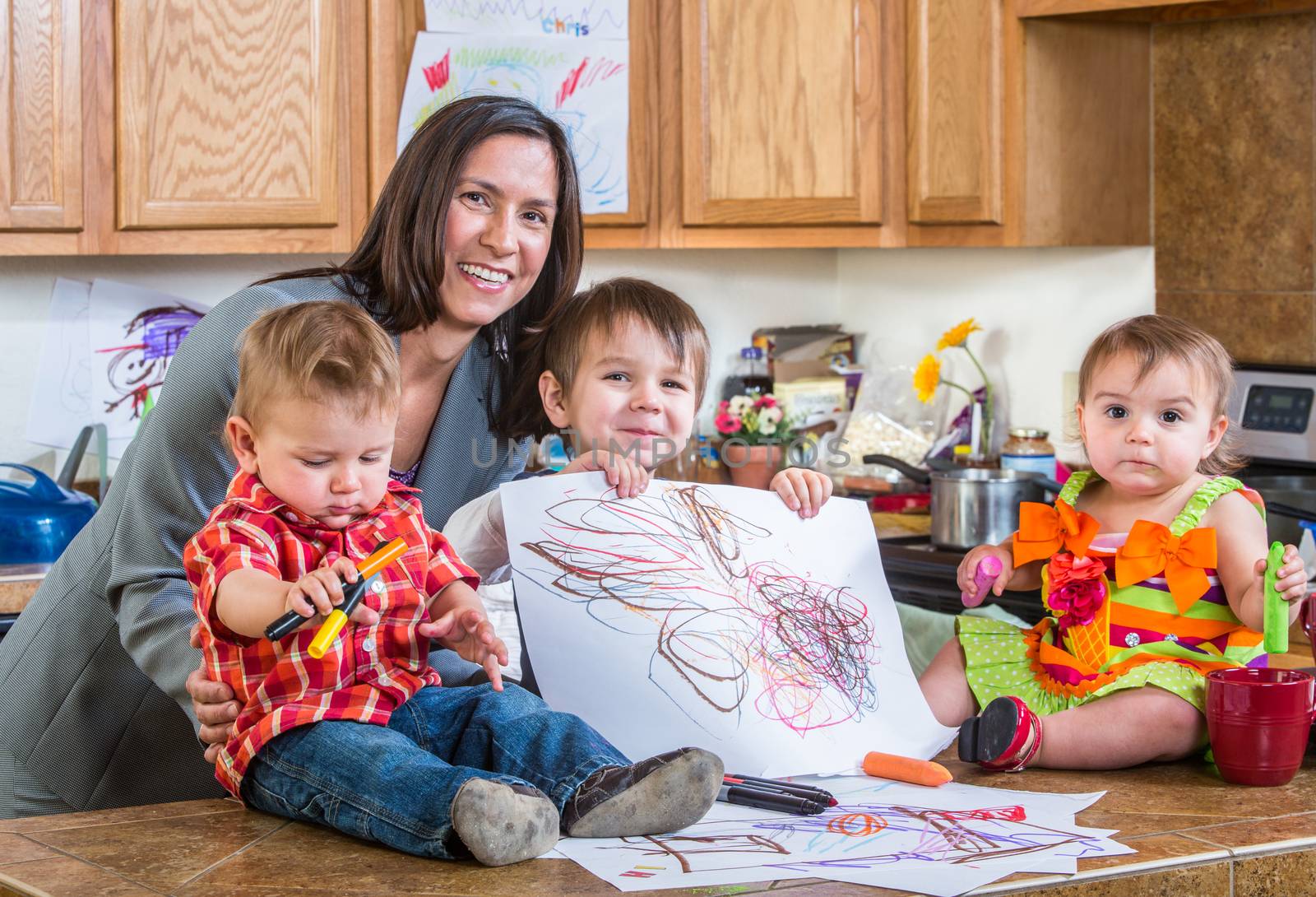 Mother poses with children in the kitchen