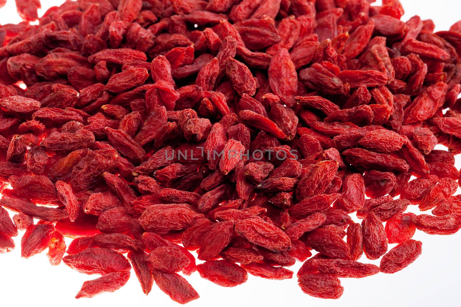 a lot of of red goji berry isolated on white background close up