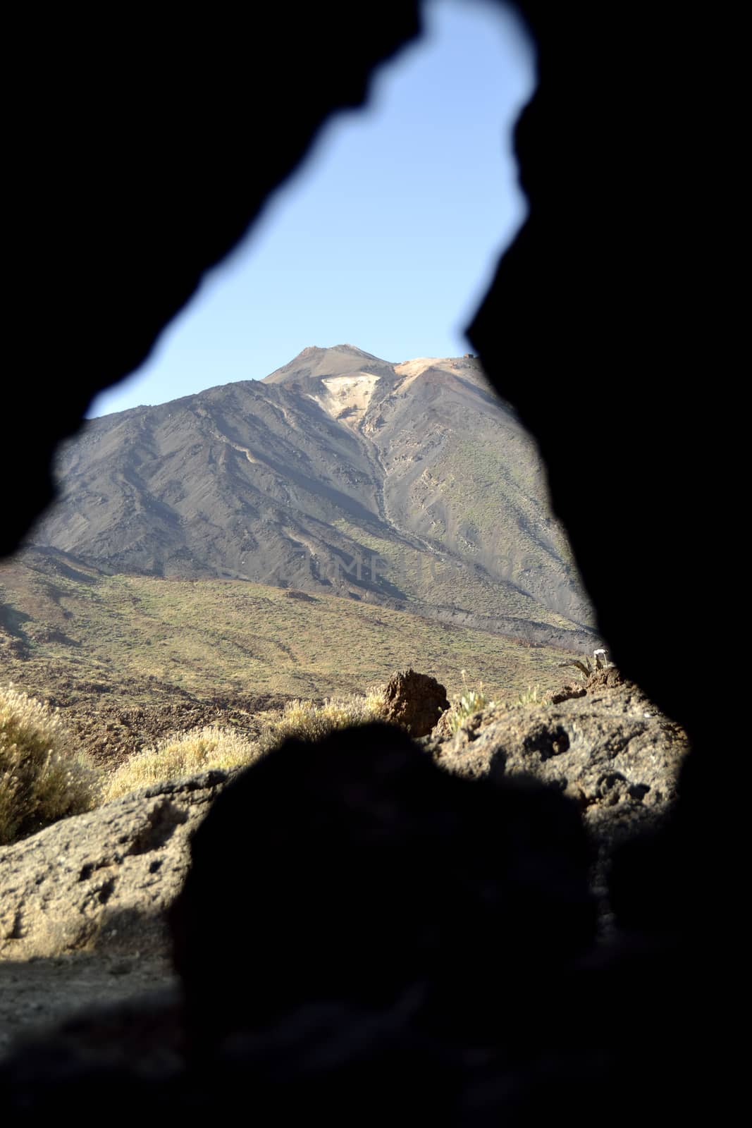 El Teide through a hole in a rock by ncuisinier