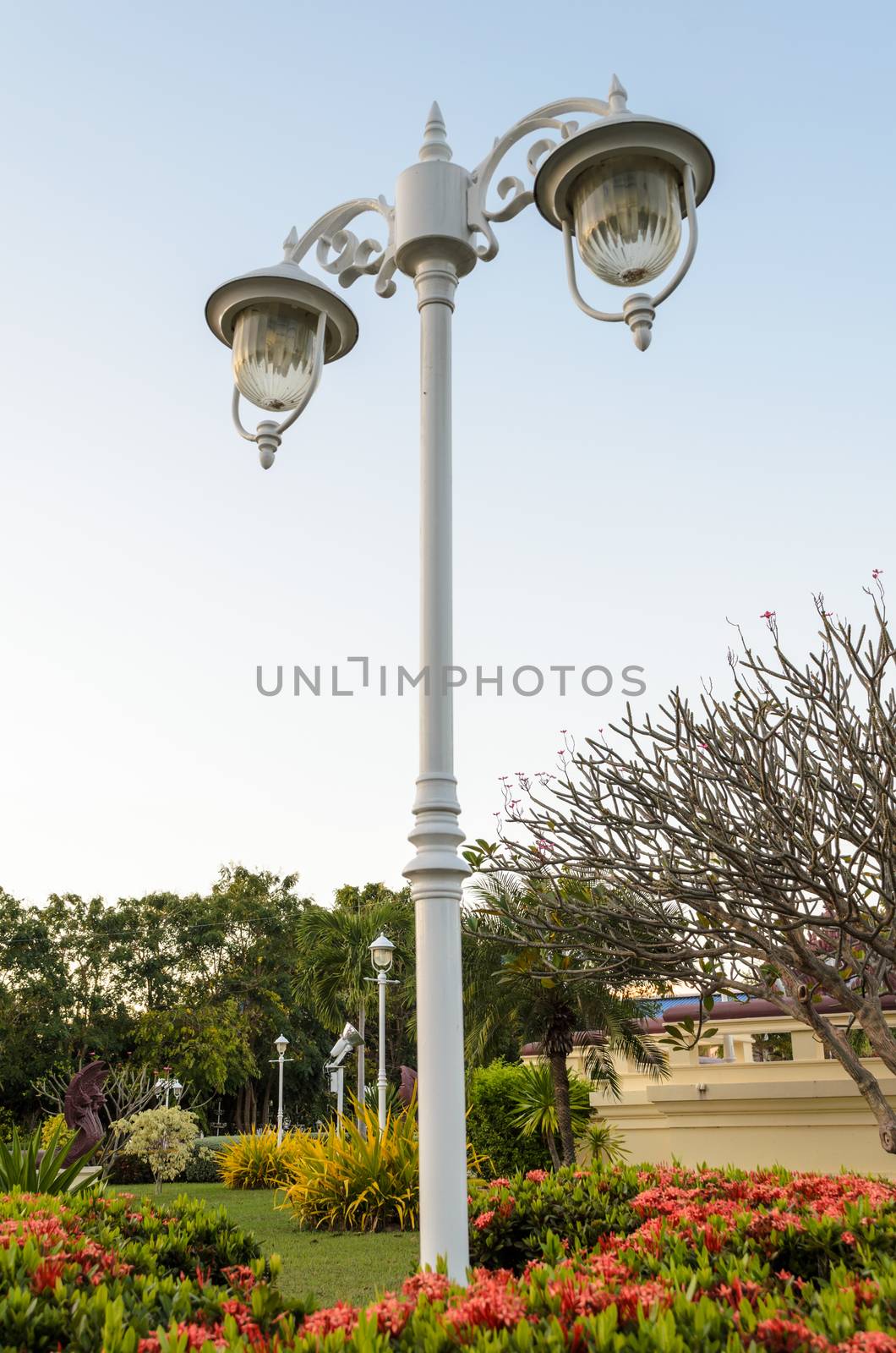 White lamp on pole retro style in garden
