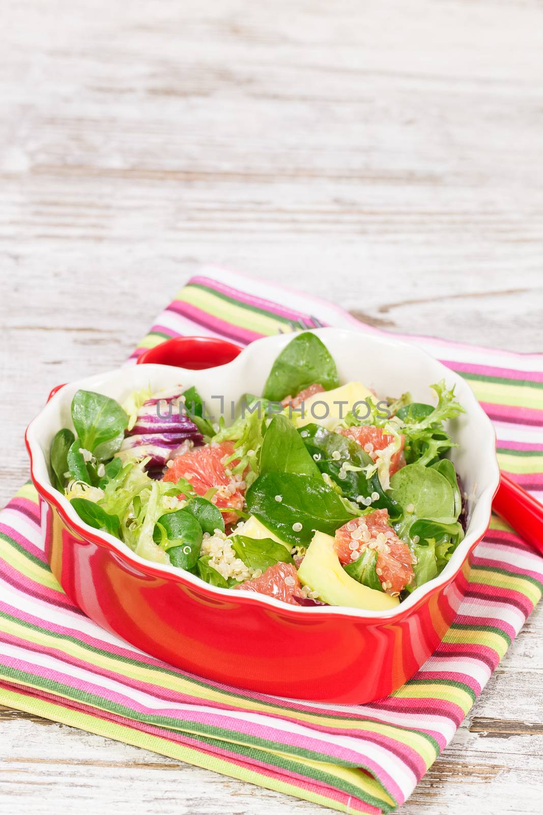 Spinach and quinoa salad with grapefruit and avocado.