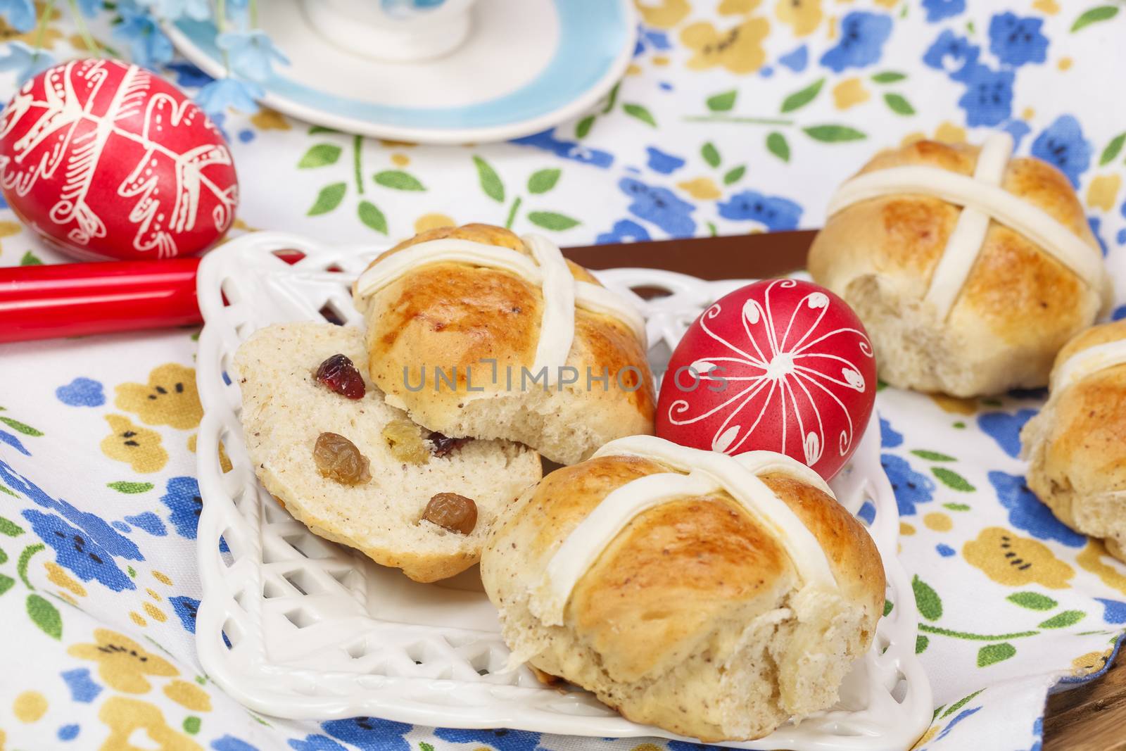 A Traditional Easter treat. Spiced, sticky glazed fruit buns with pastry crosses. Delicious warm from the oven, or lightly toasted for tea or breakfast. Macro, selective focus