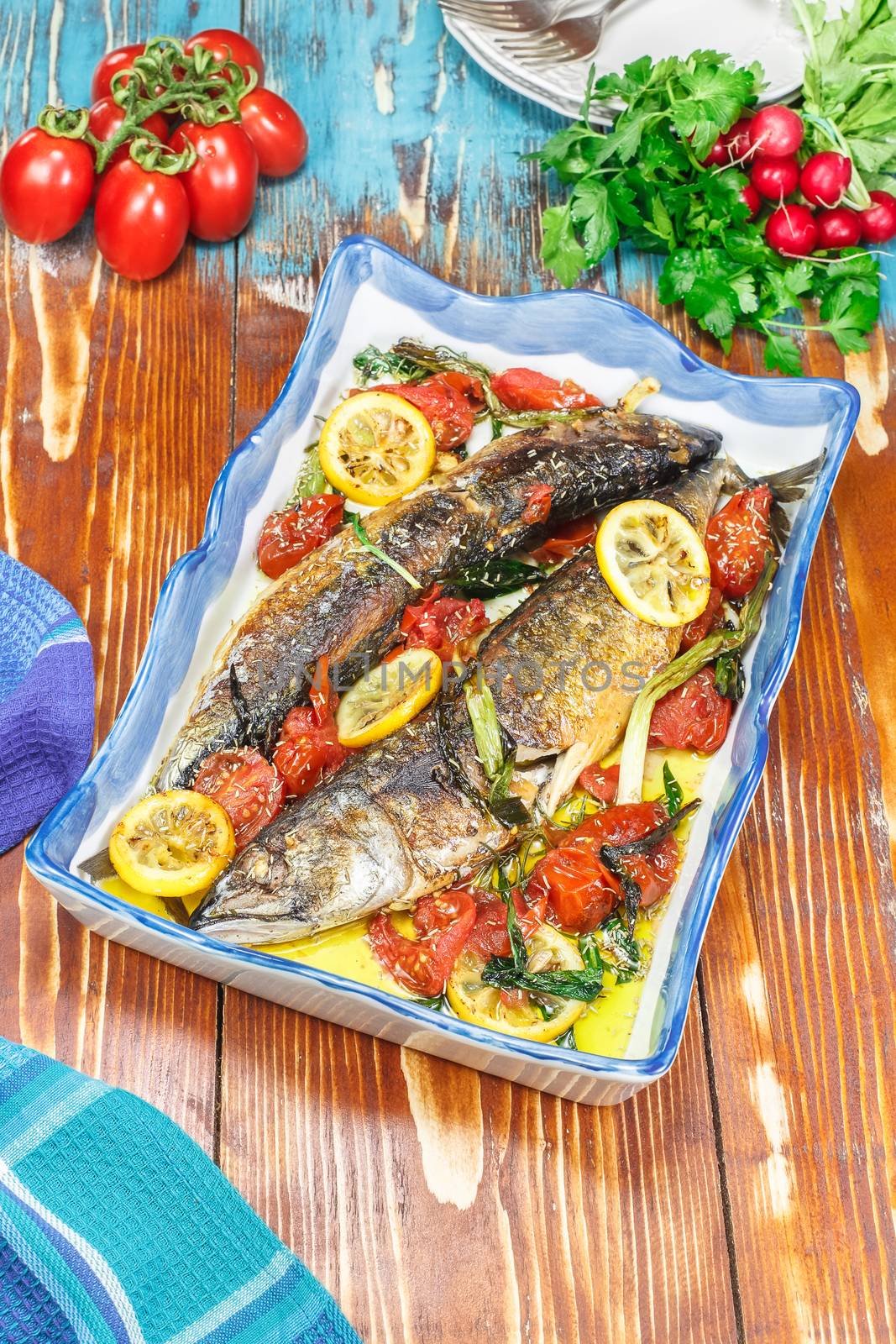 Roasted mackerel and tomatoes with garlic, basil and lemon