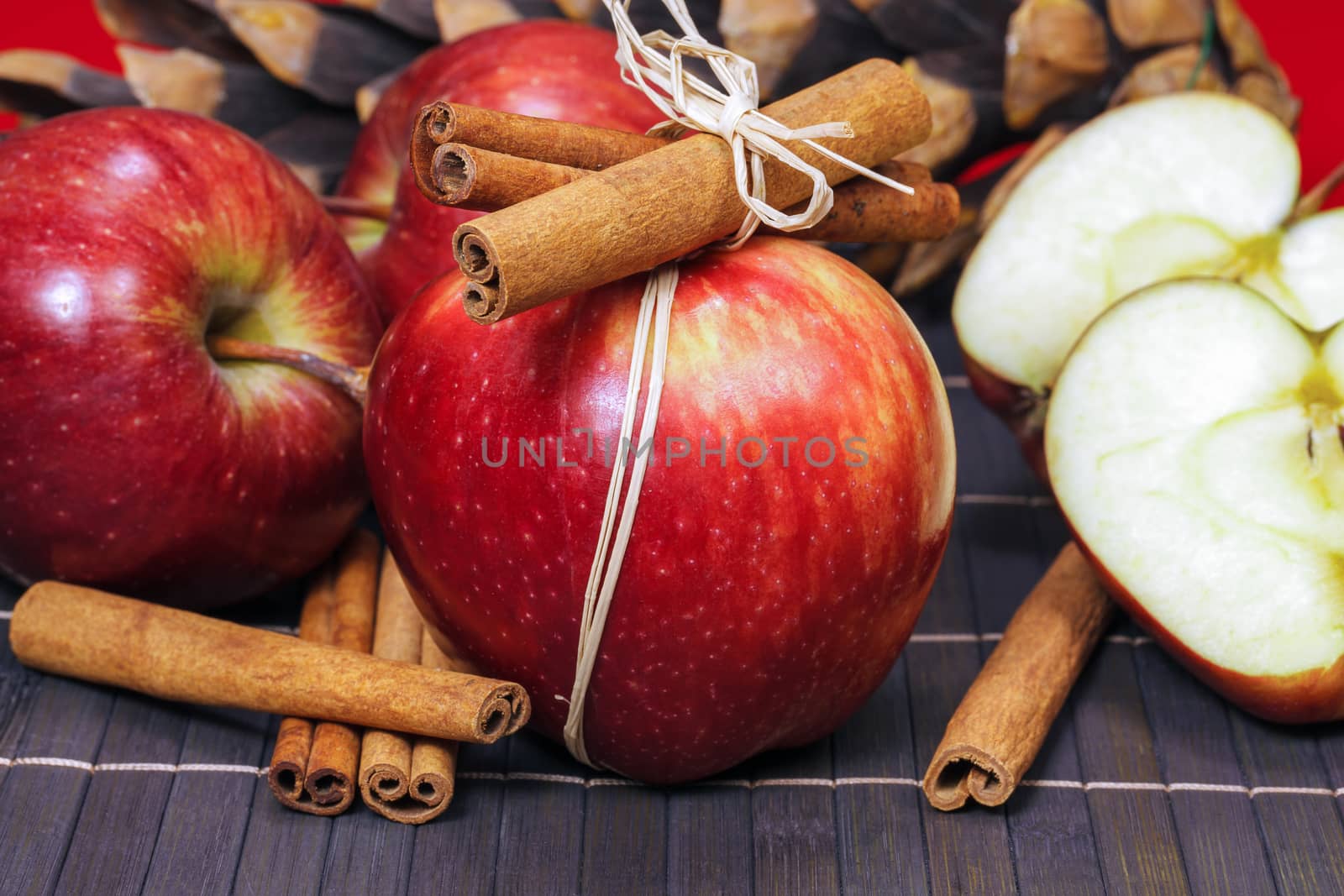 Red winter apples with cinnamon sticks