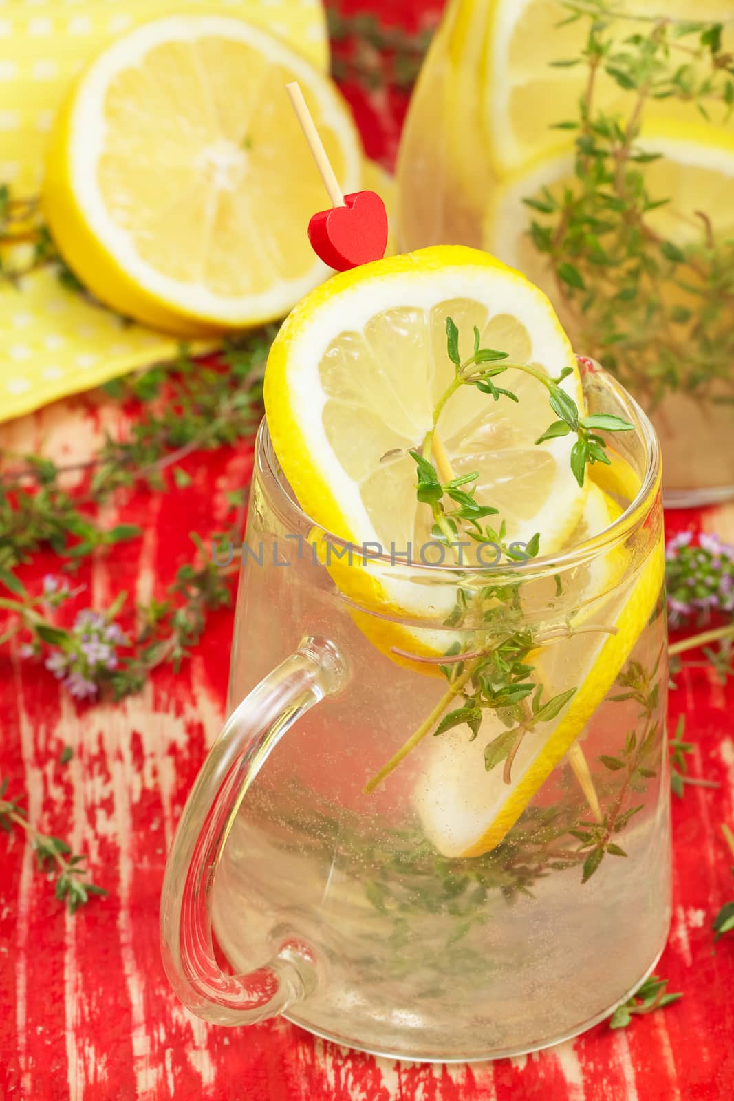 Pitcher and Glass of Lemonade with Fresh Lemons