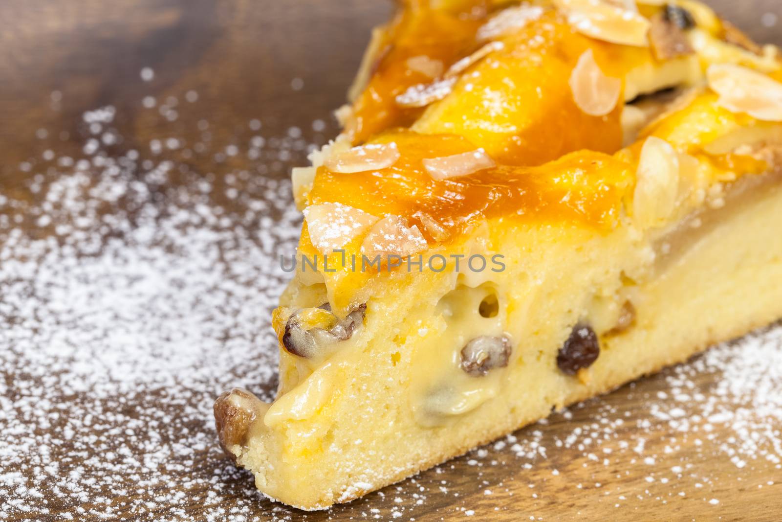 Piece of fresh apple pie on a wooden background with copy space. Close up