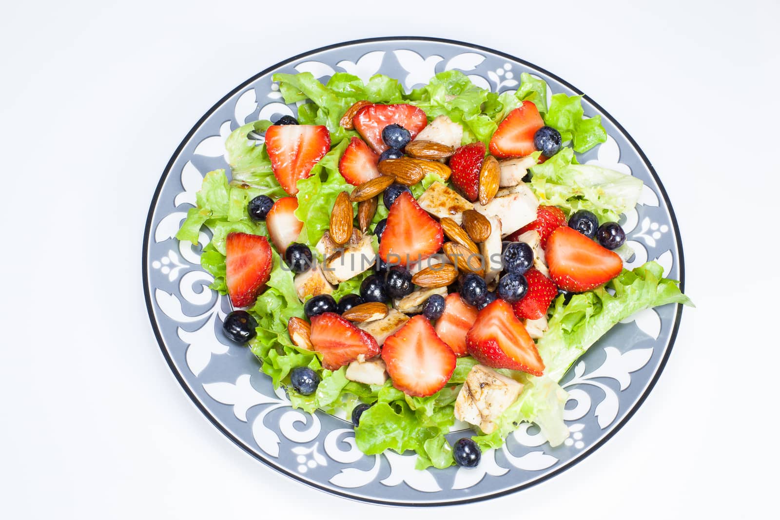 Berry salad with chicken, almond and lettuce. Summer salad. Viewed from above