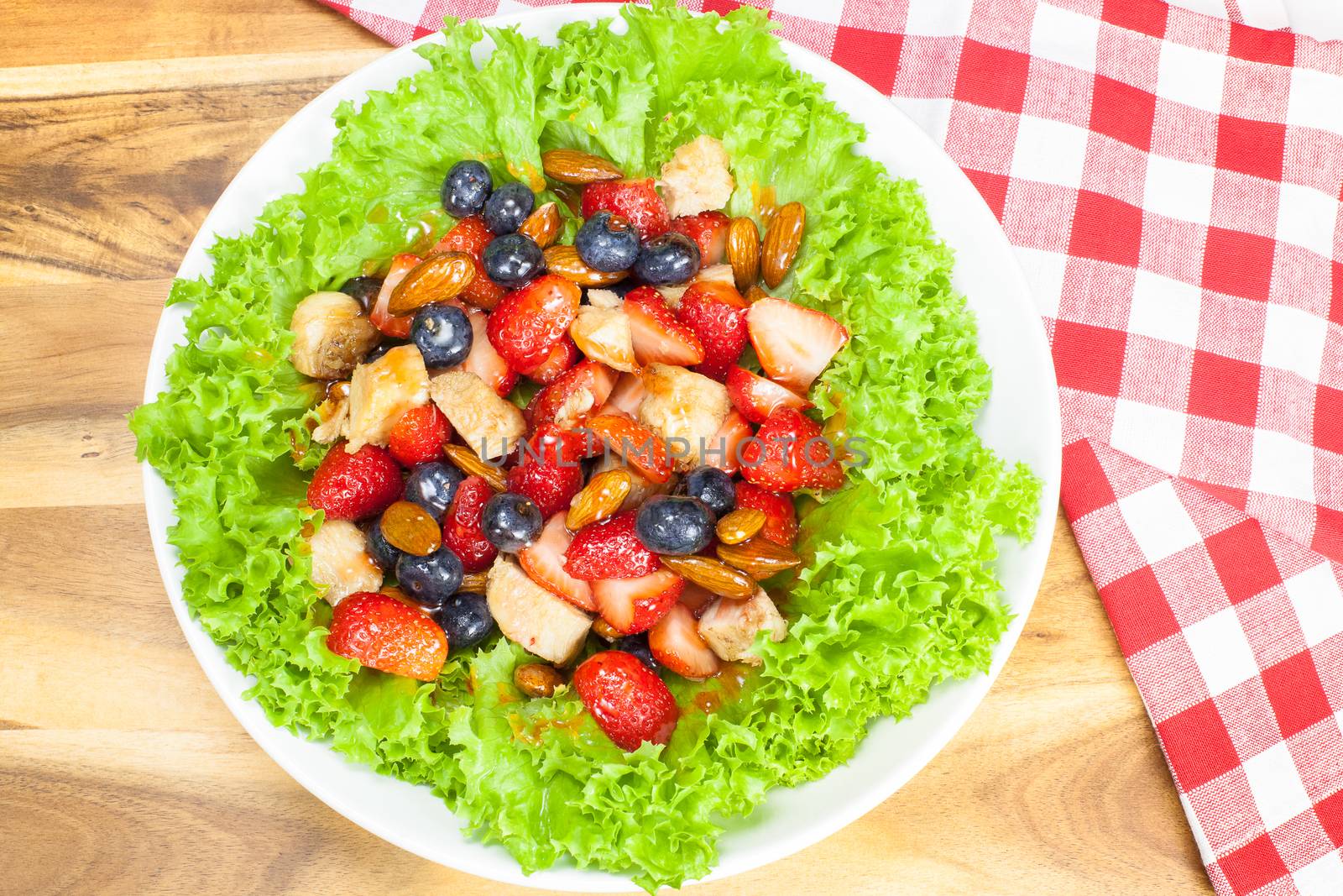 Mixed berry salad with chicken, almond and lettuce. Summer salad. Viewed from above
