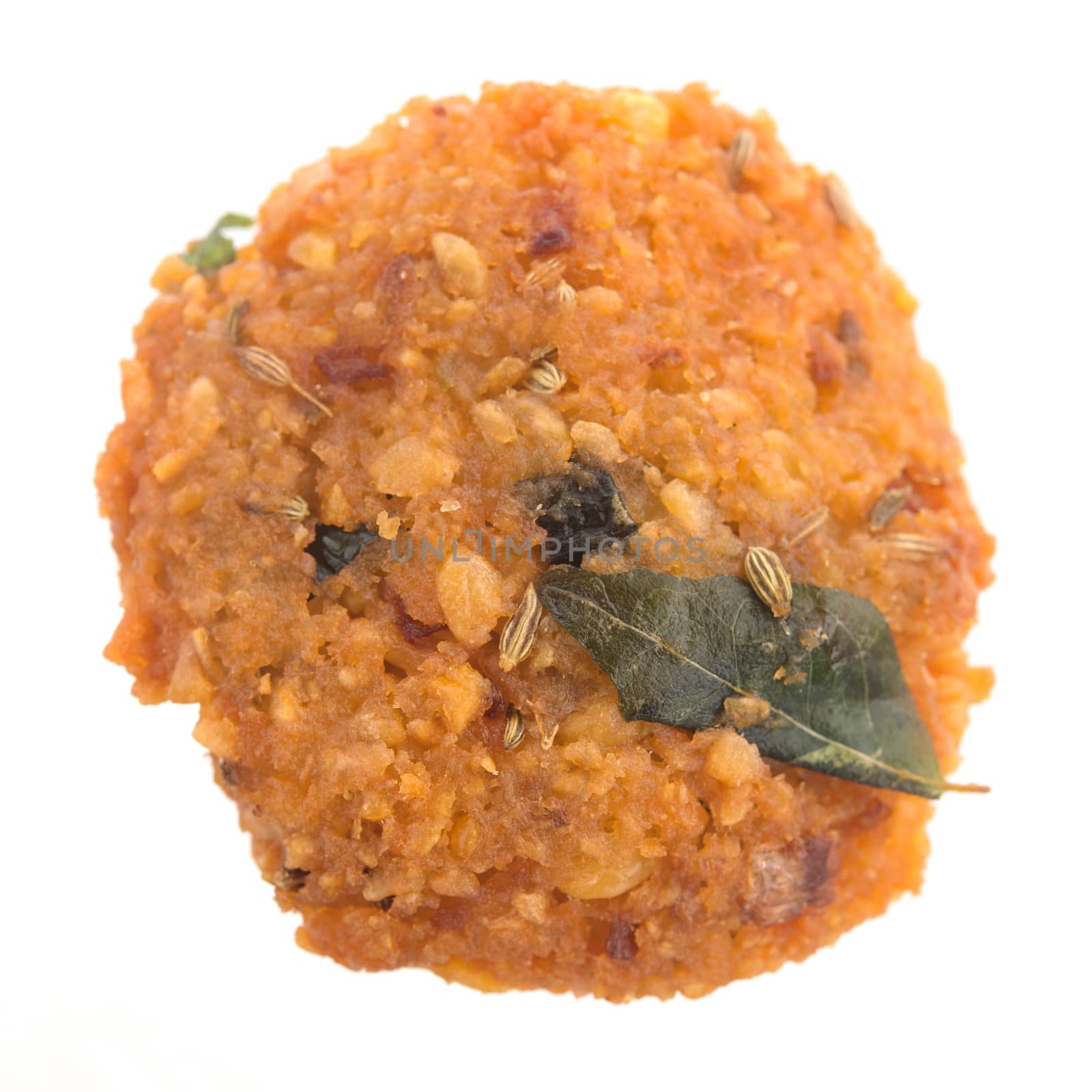 Crispy deep fired vadai snack, very common street food in the Indian Subcontinent and Sri Lanka, shoot isolated on white background.