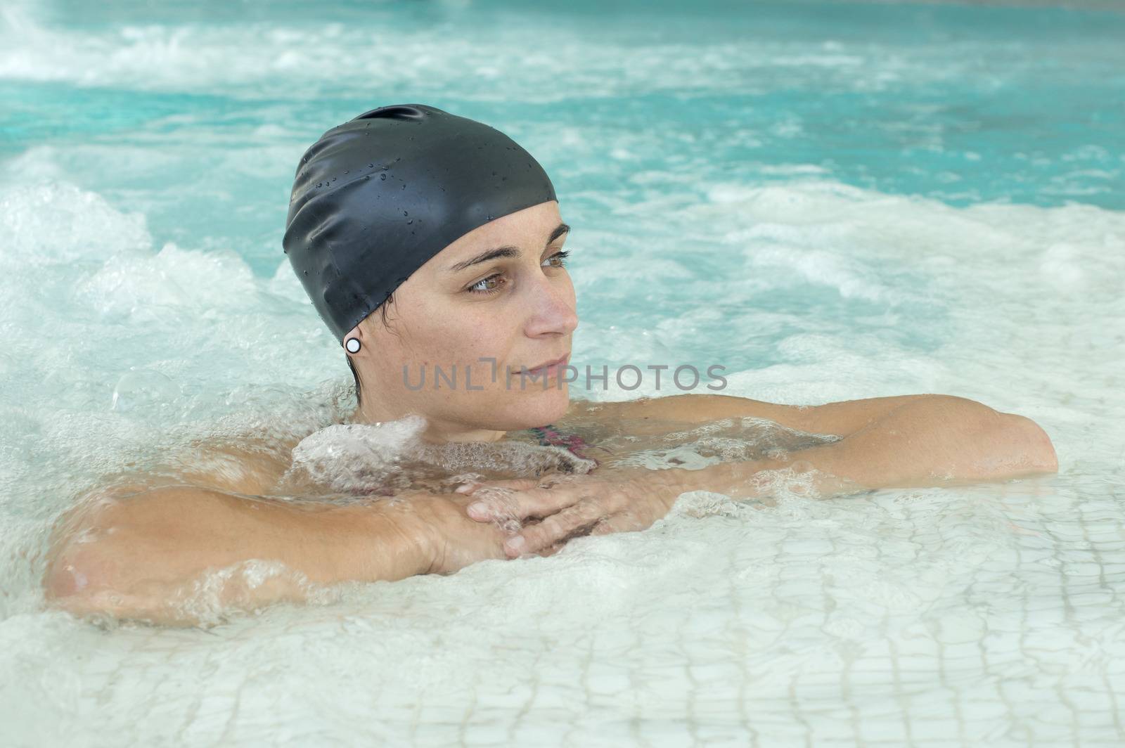 young woman standing in a swimming pool