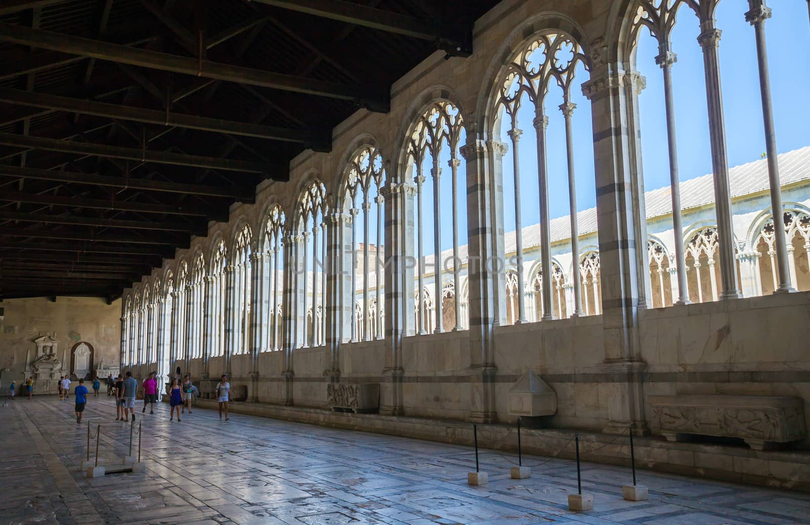 Pisa, Italy - August 11, 2013: Camposanto Pisa gallery interior view, Piazza del Duomo, Italy