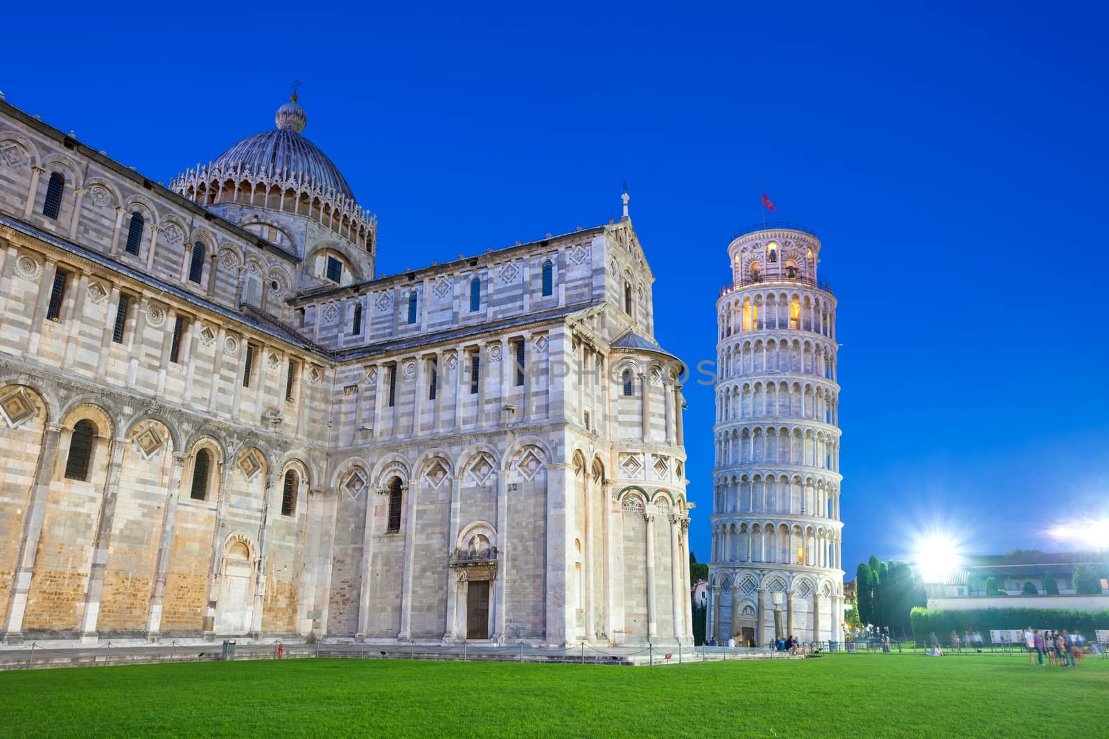 Pisa, Italy - August 11, 2013: Piazza del Duomo with Pisa tower and the Cathedral illuminated at night, Pisa, Italy