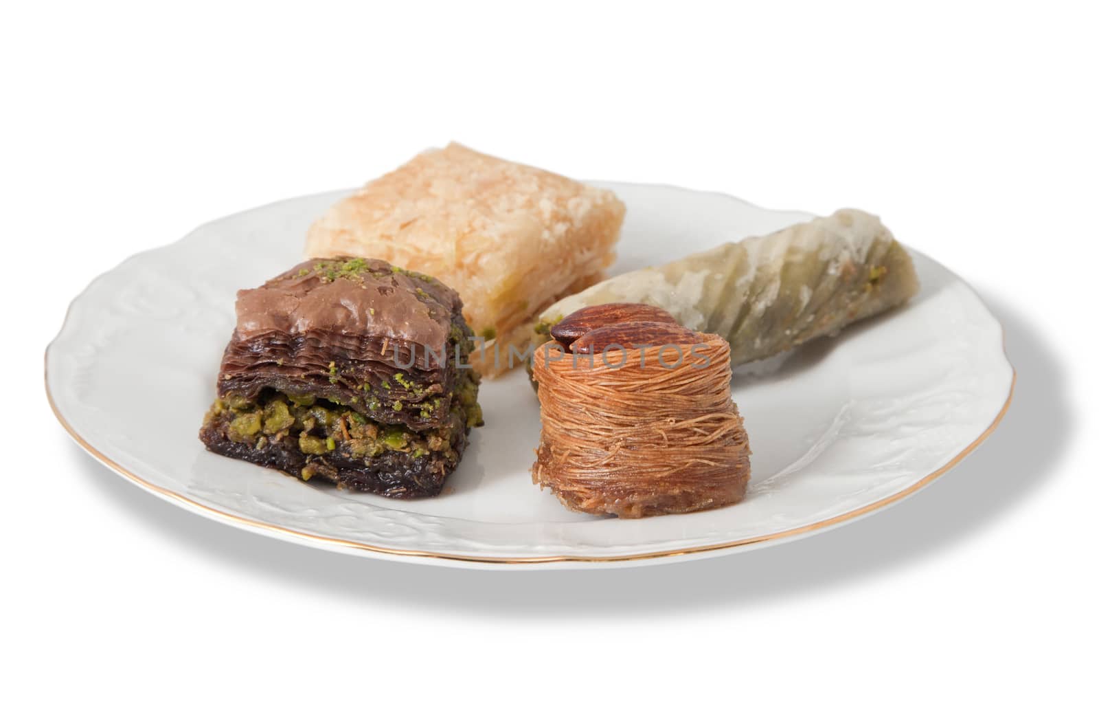 Plate with various turkish baklava isolated over white background