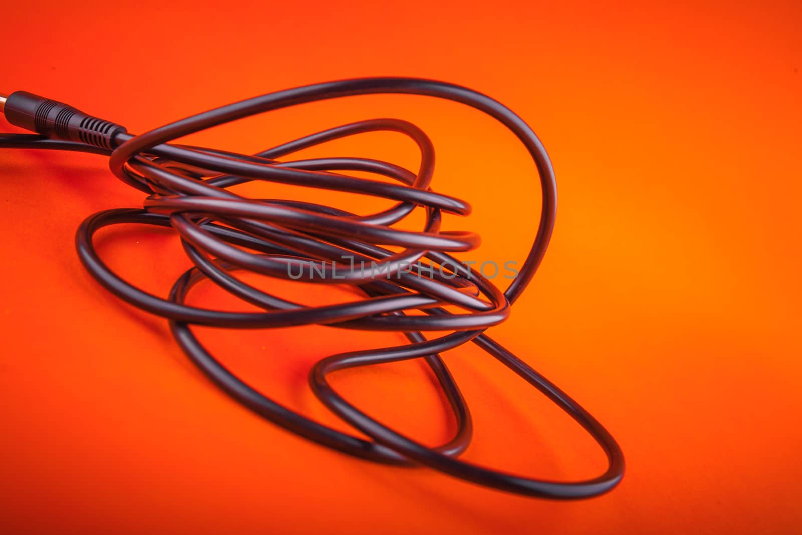 Abstract  flexible audio cable on orange , great music background