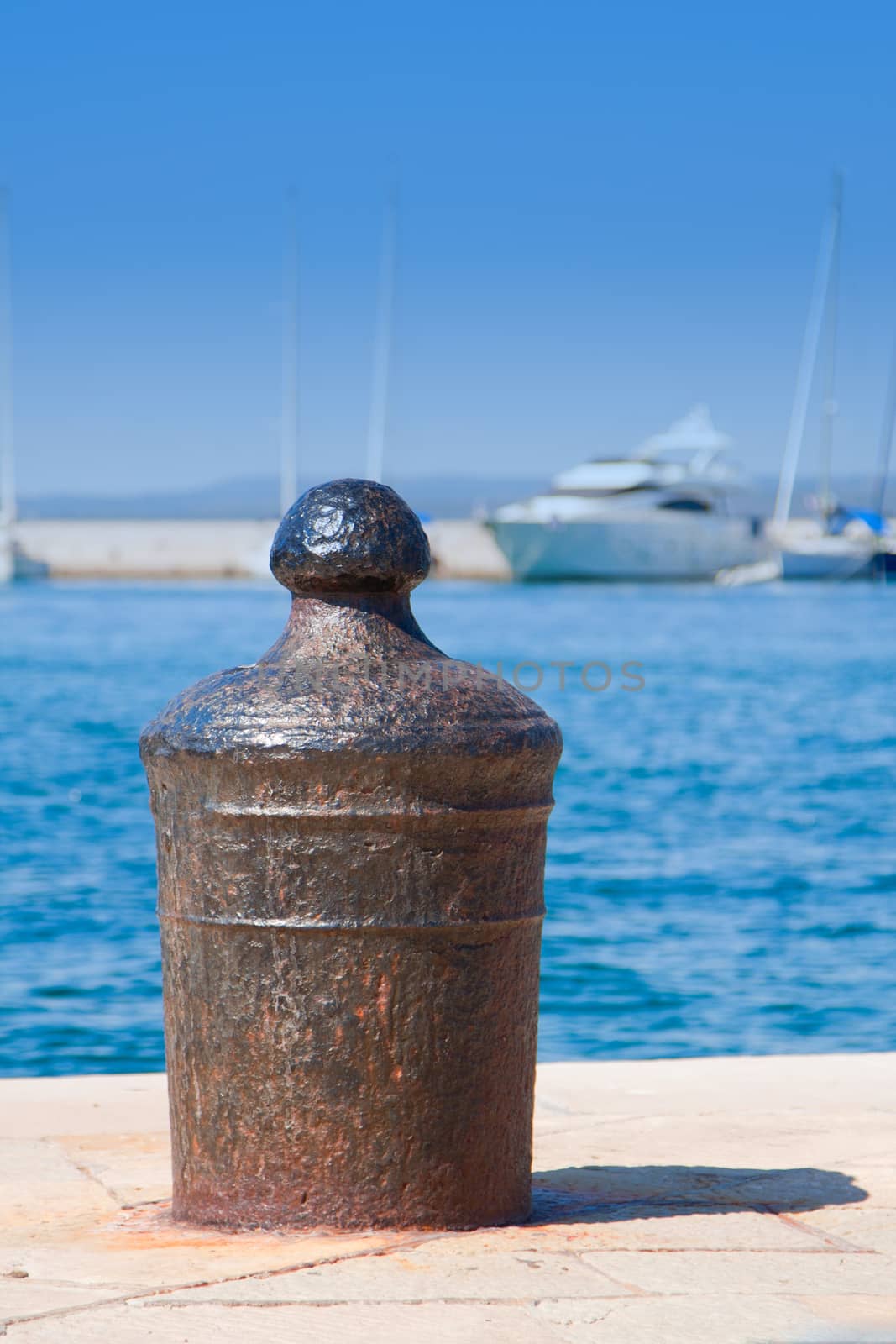 Pier in a small Mediterranean town by Lizard