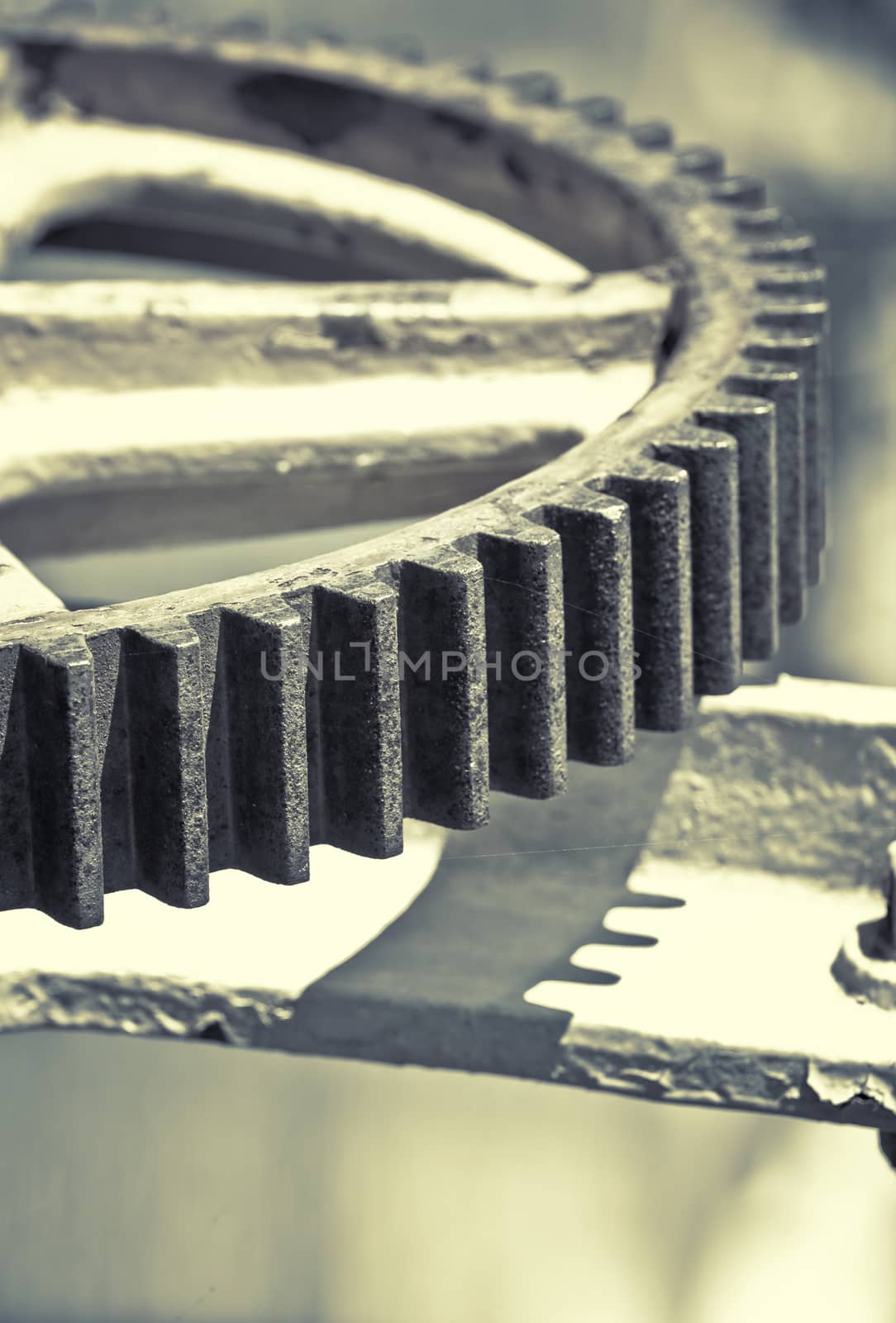 Gear wheel mechanism, artistic toned photo with shallow dof