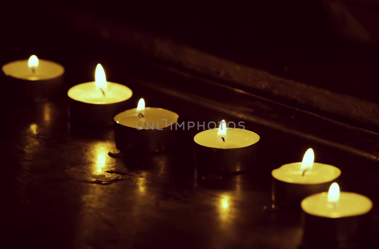 Burning candles retro toned