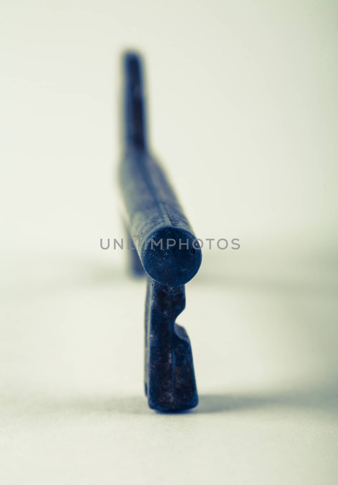 Old key on white background by Lizard
