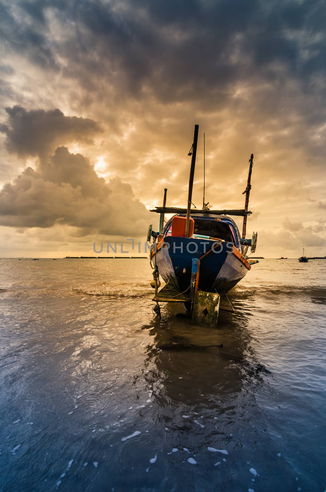 Fishing sea boat and Sunrise clouds before strom in Thailand blue  light tone