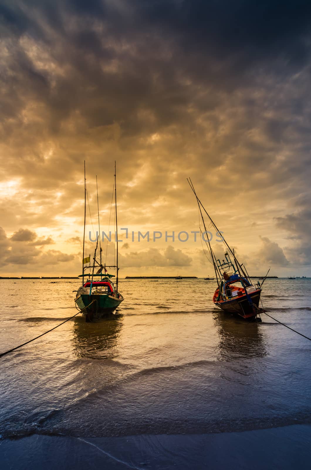 Fishing sea boat and Sunrise clouds before strom in Thailand blue  light tone