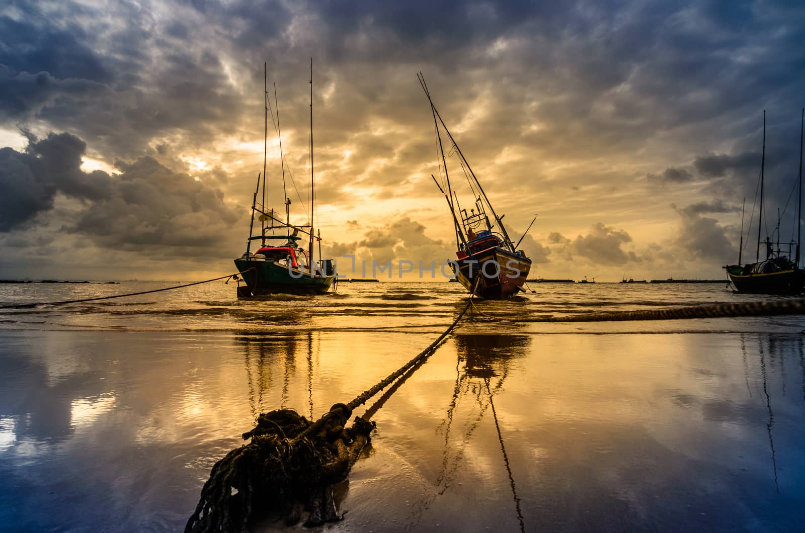 Fishing sea boat and Sunrise clouds before strom in Thailand blue  light tone