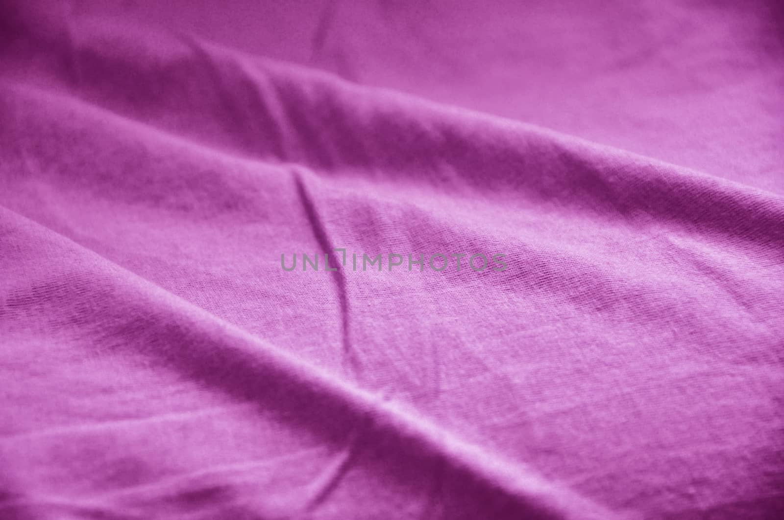 texture of cotton cloth with shadows, vivid color and deep purple