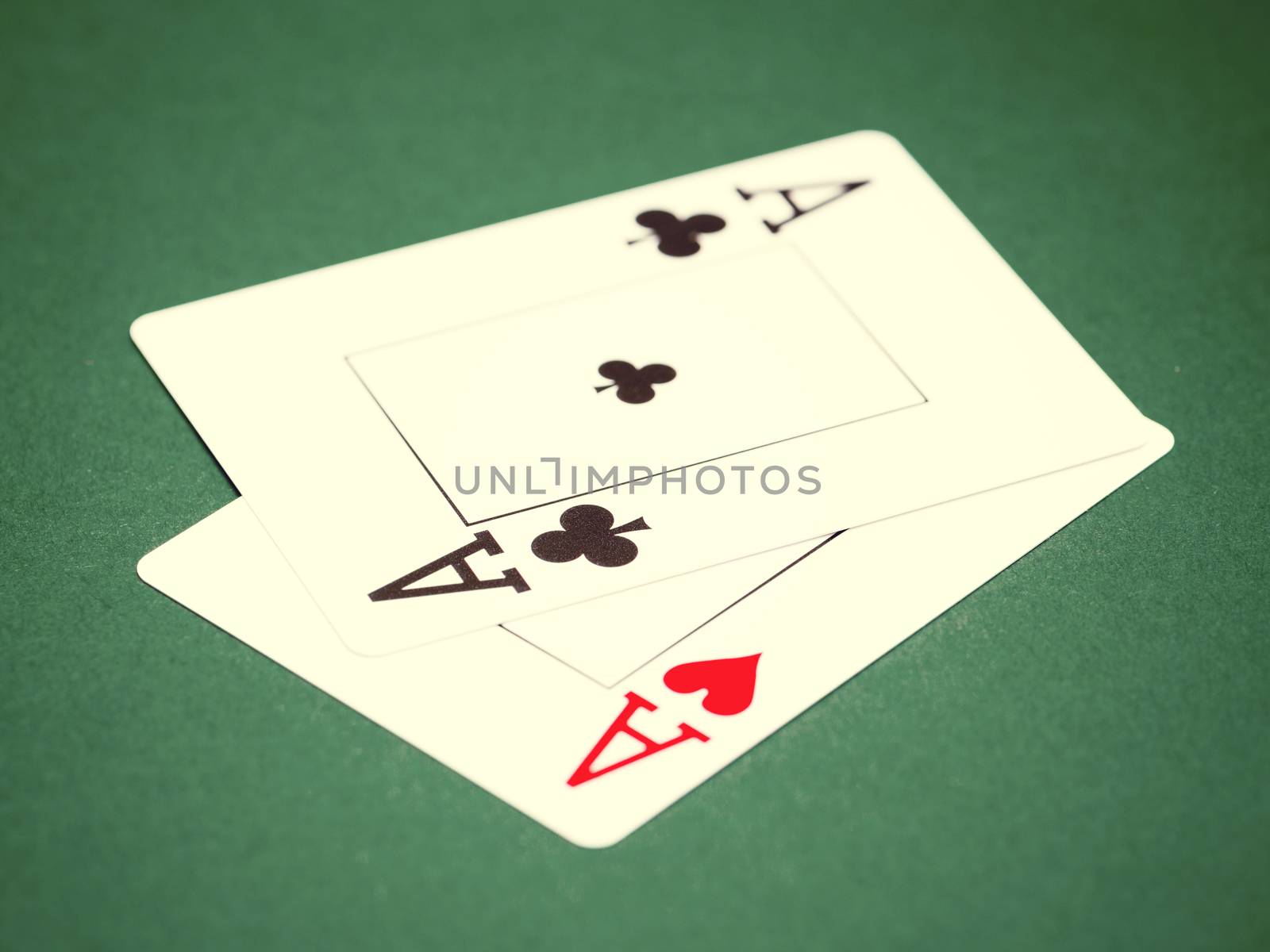playing cards on a green table casino