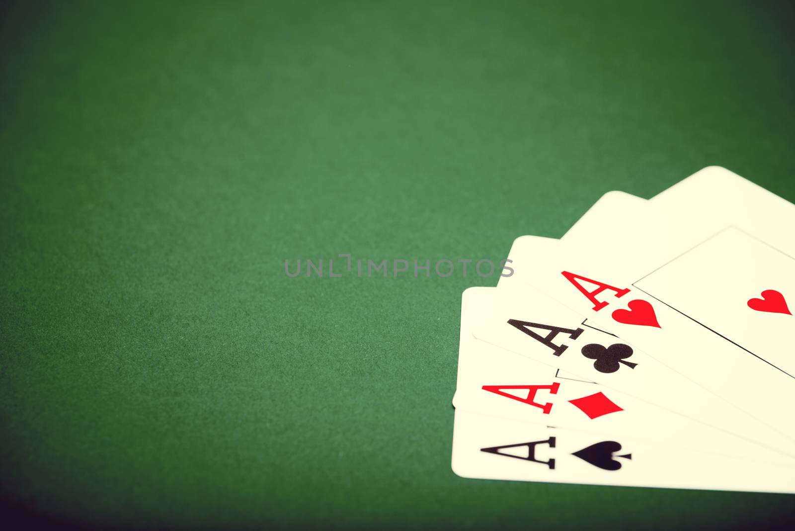 playing cards on a green table casino
