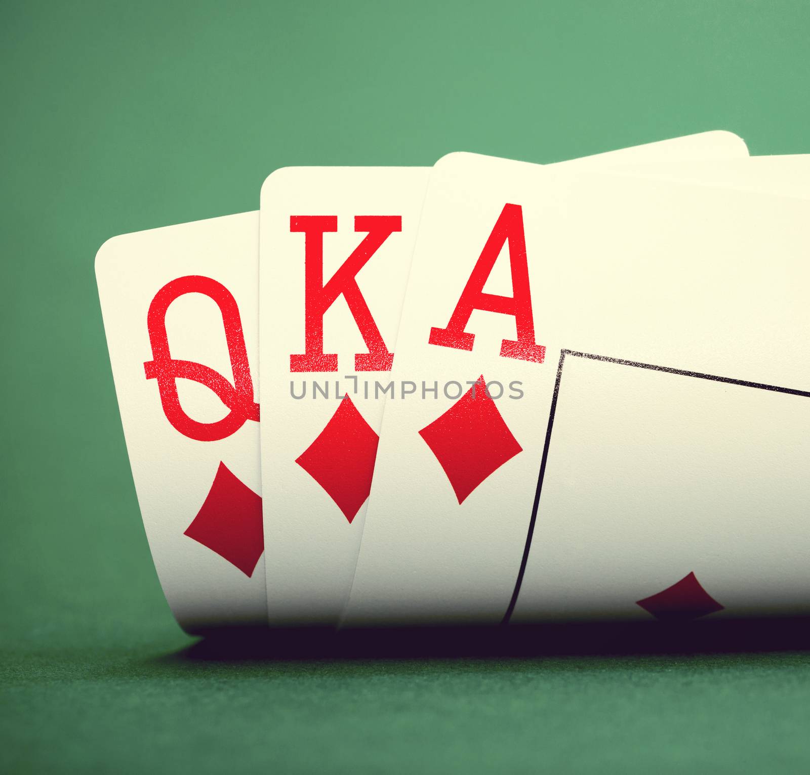 playing cards on a green table casino