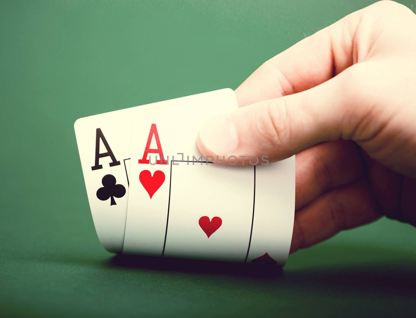 playing cards on a green table casino